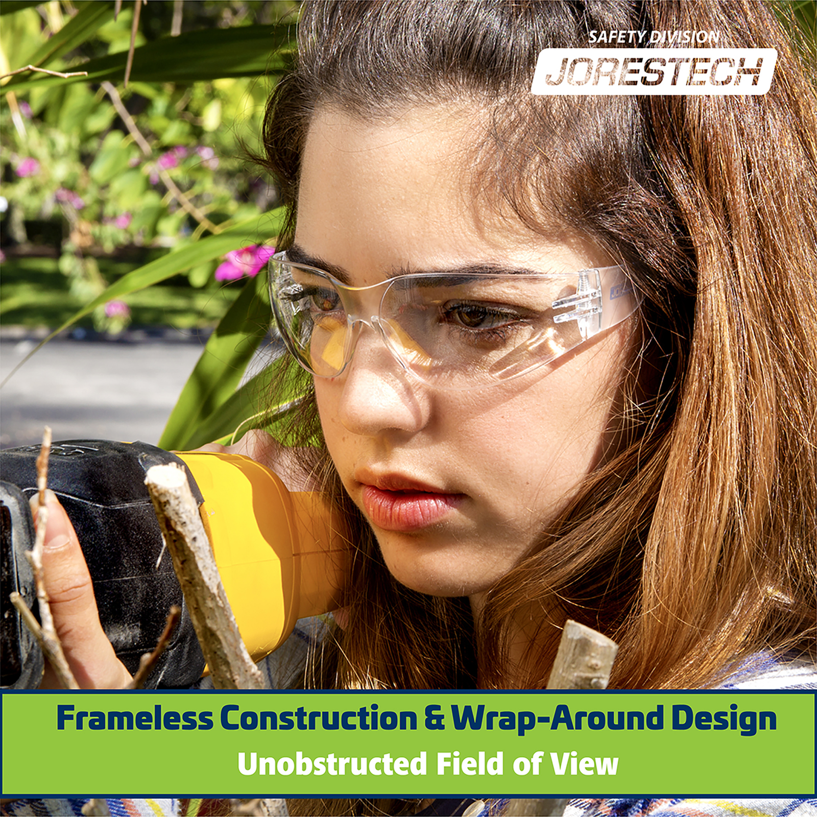 A lady wearing JORESTECH anti-fog safety glasses while operating a power tool. Green banner with blue letters read: frameless construction & wrap around design. Unobstructed field of view. 