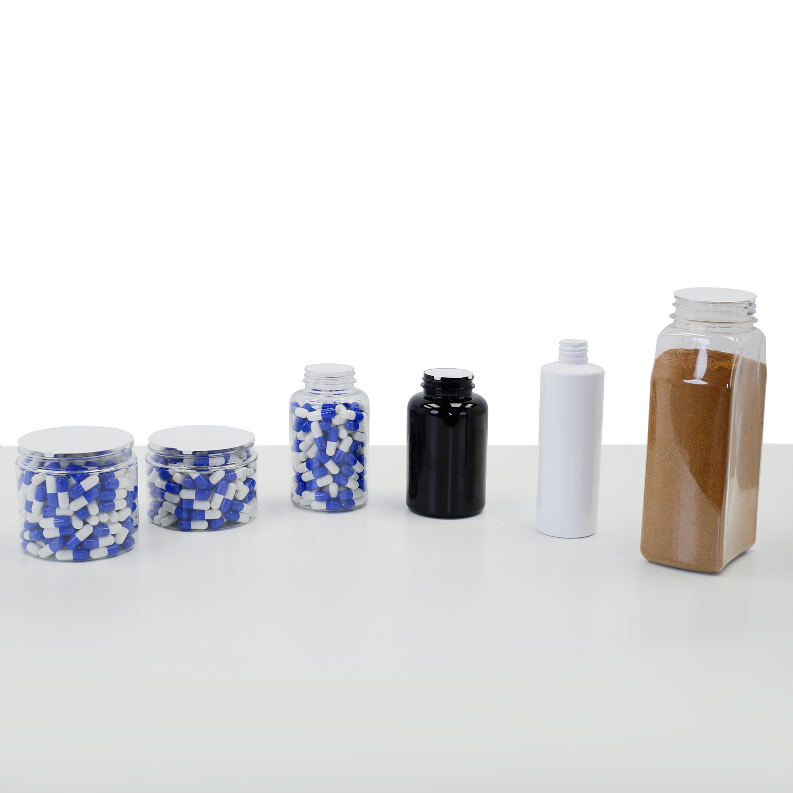 A collection of containers of different sized which have been sealed with induction liners using the JORES TECHNOLOGIES® electromagnetic cap sealer