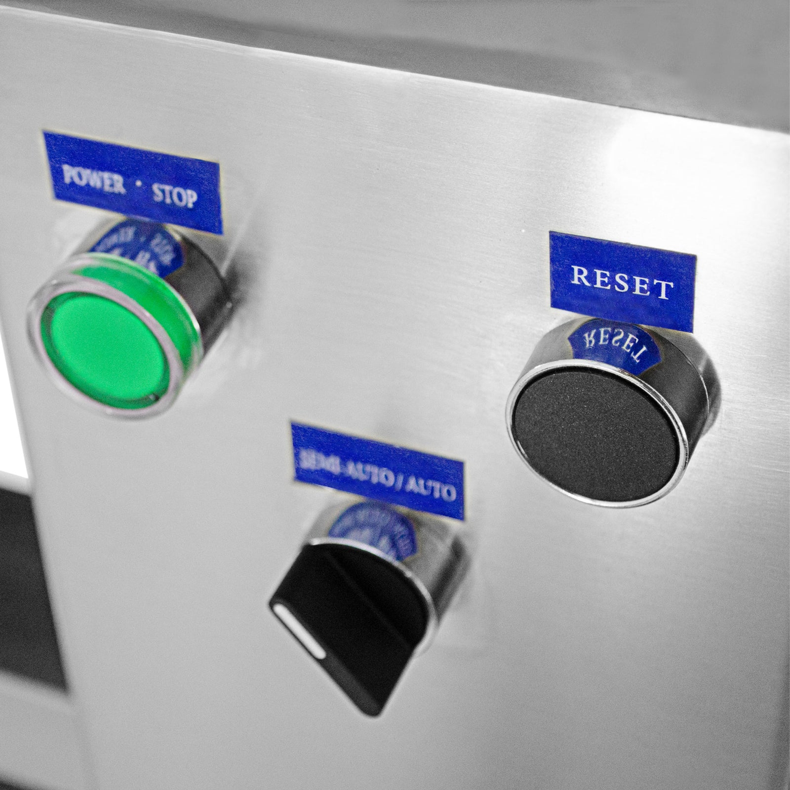 Close-up of the user-friendly control panel. The panel includes an ON/OFF, Reset, and Semi-Automatic and Auto switch knobs.
