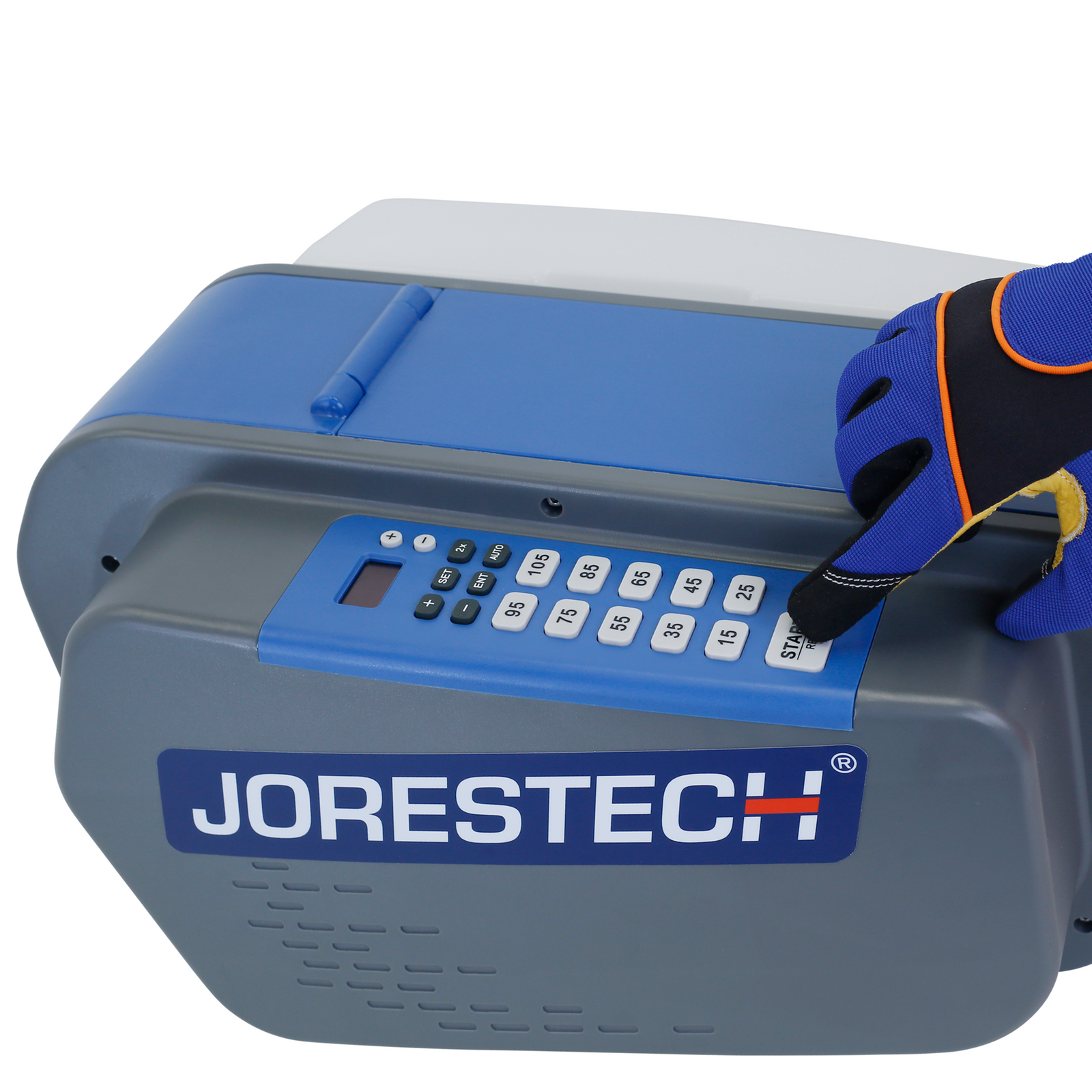 The hand of a worker wearing a safety glove while pressing the start bottom of the JORES TECHNOLOGIES® tape dispenser