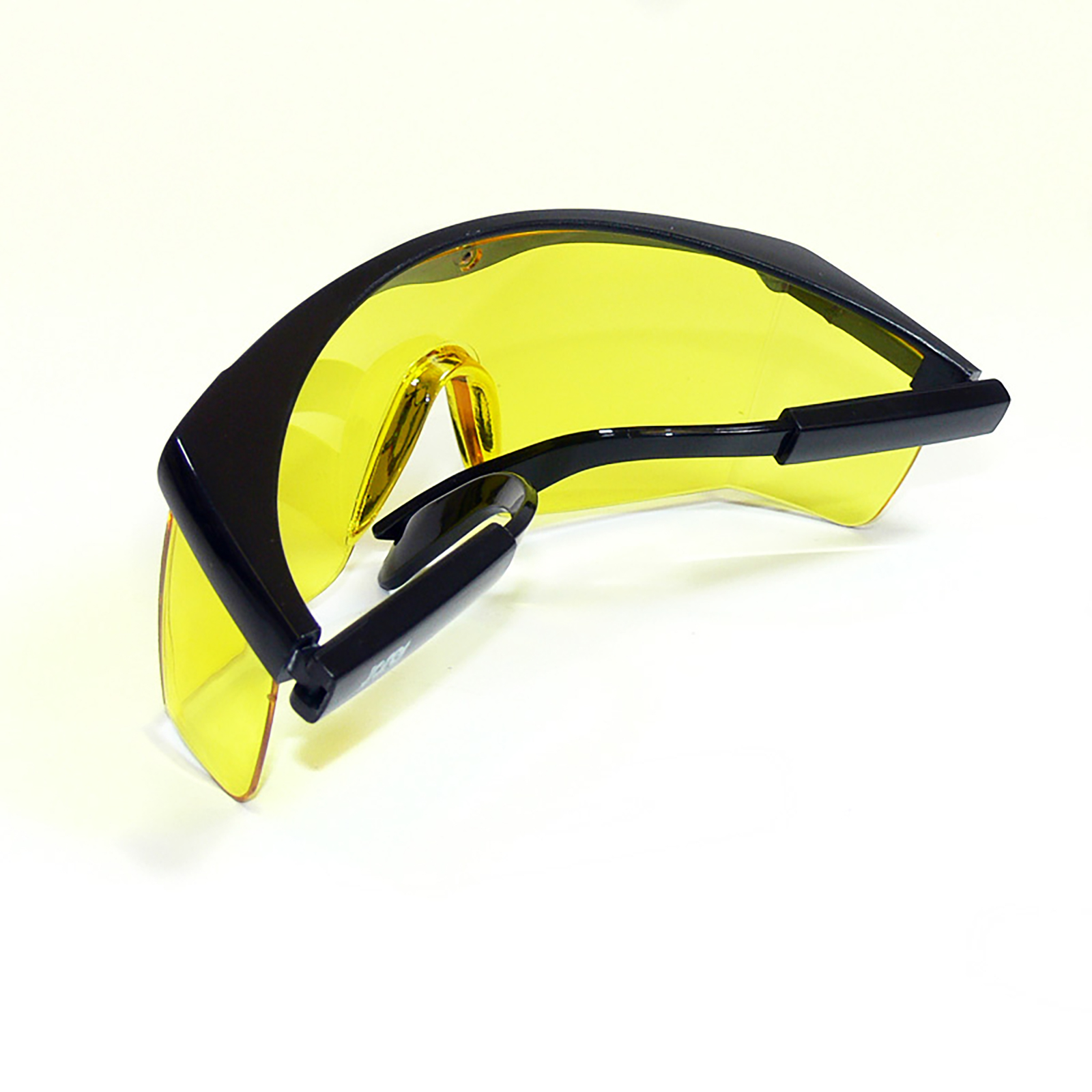 back folded view of the black framed rectangular safety yellow glasses with side shields for high impact protection with adjustable temple legs