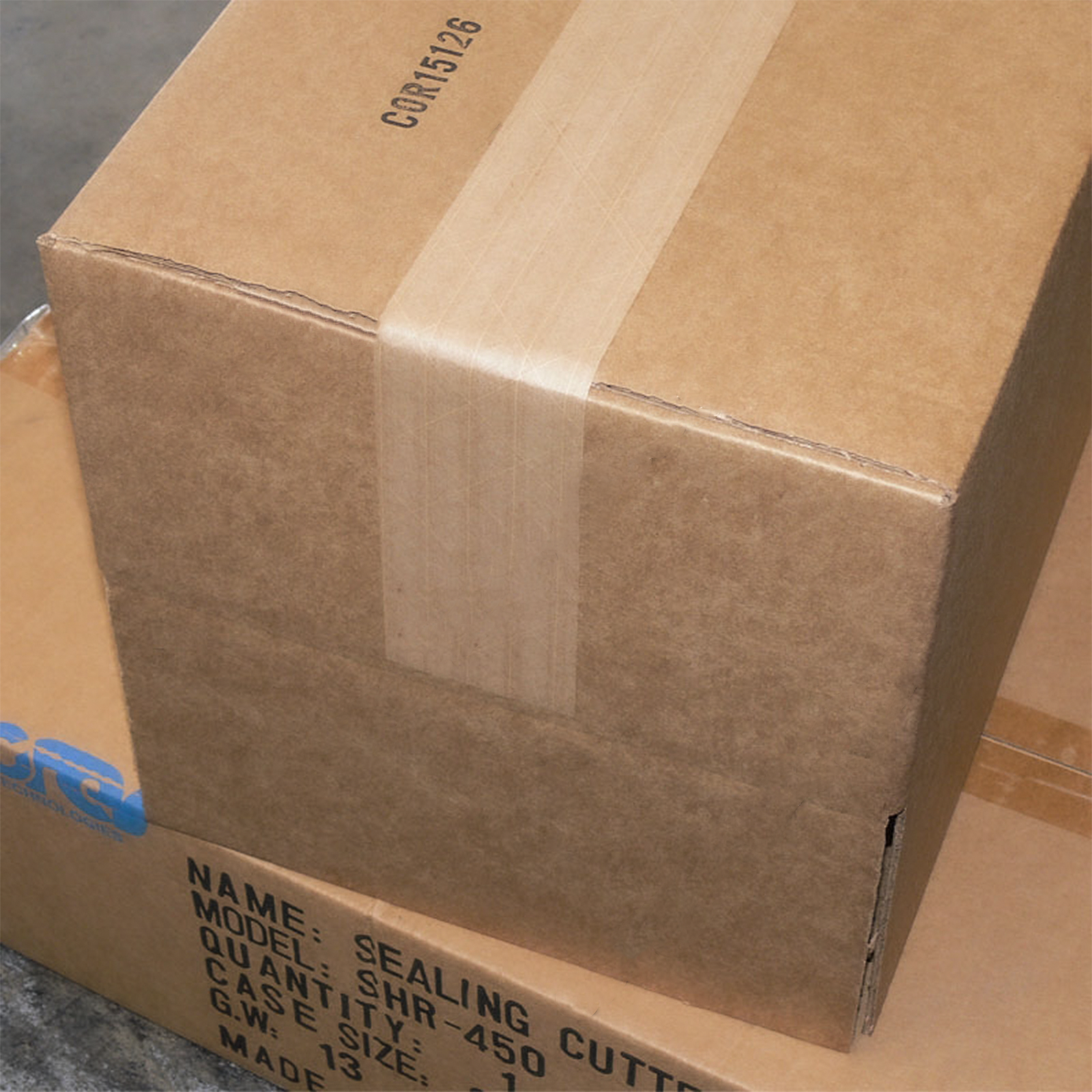 pair of stacked brown boxes sealed with brown paper kraft tape