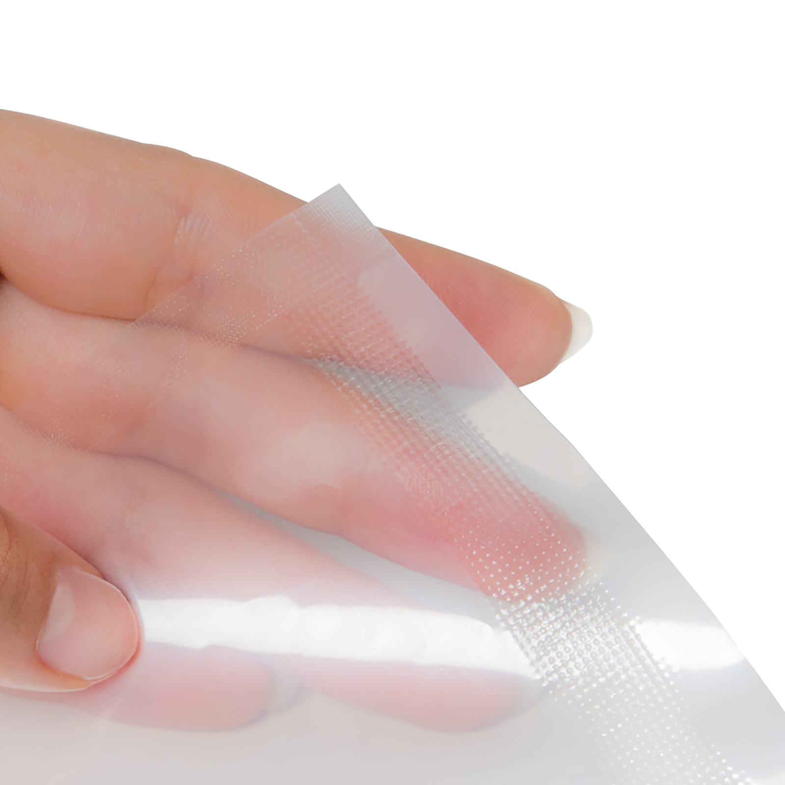 Close up of the hands of a person holding a clear sealed bag after using the JORES TECHNOLOGIES® continuous band sealer. Picture shows the pattern of the heat sealable bag