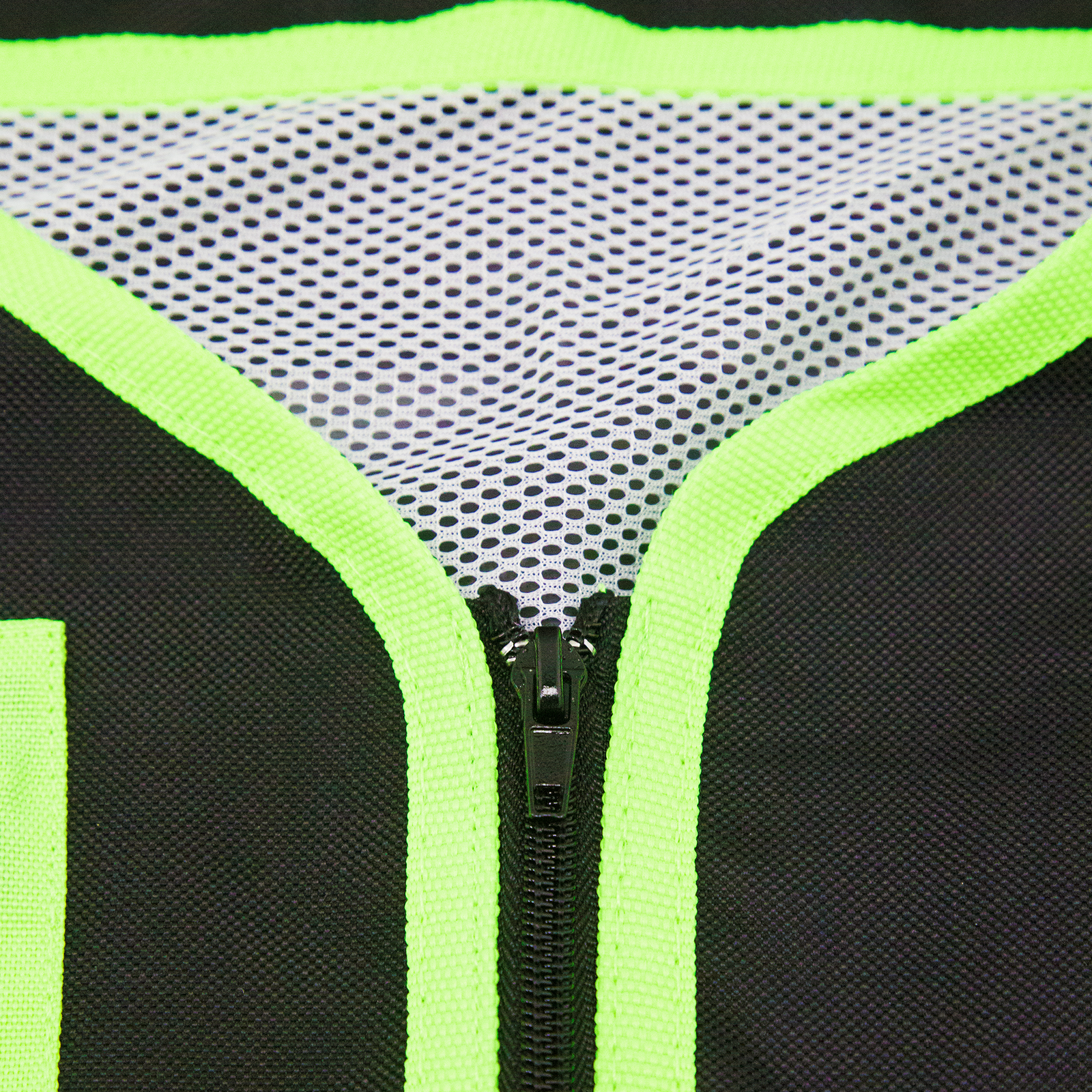 Close up shows the zipper and the mesh liner of the tool vest