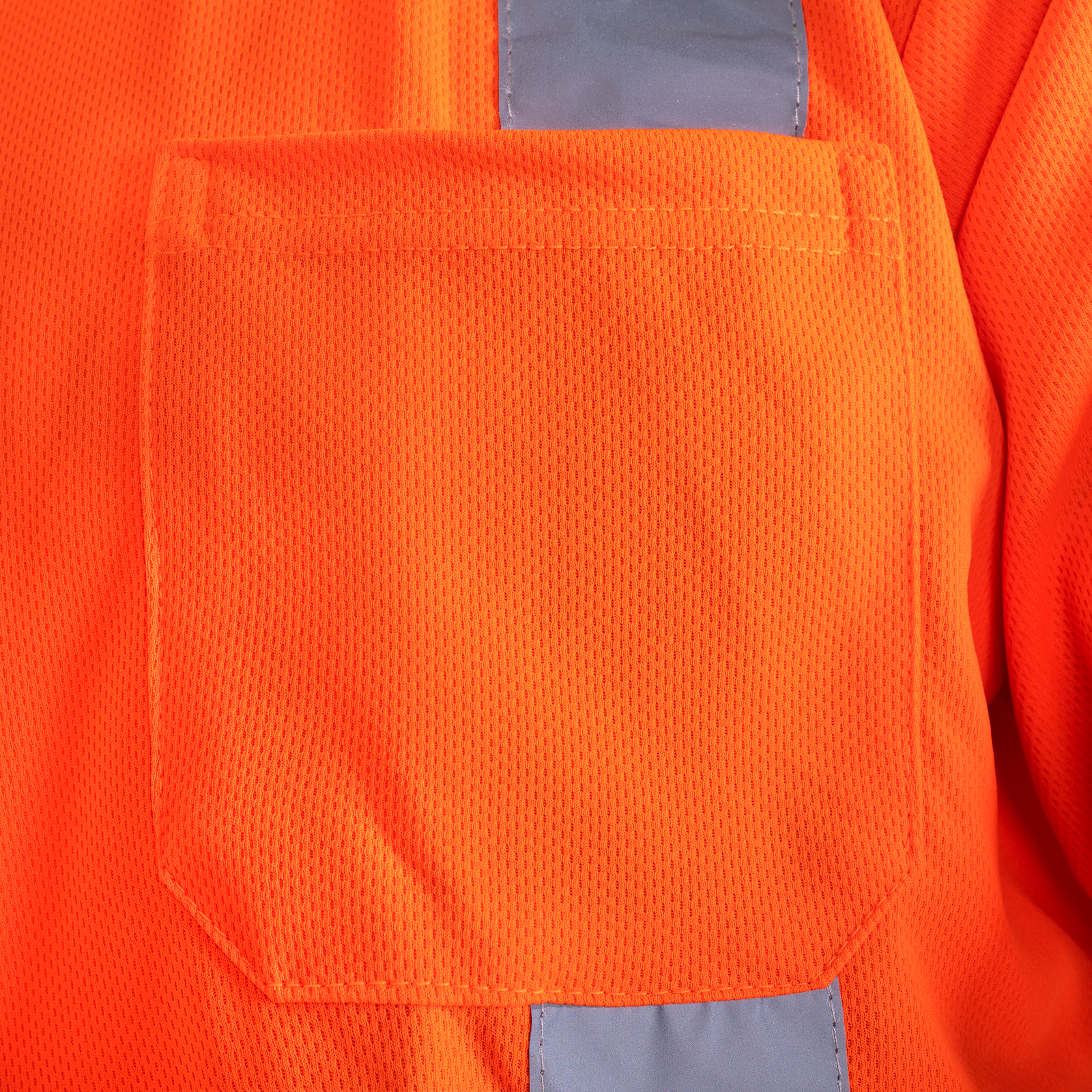 Close up of the pocket on the high visibility orange safety T shirt