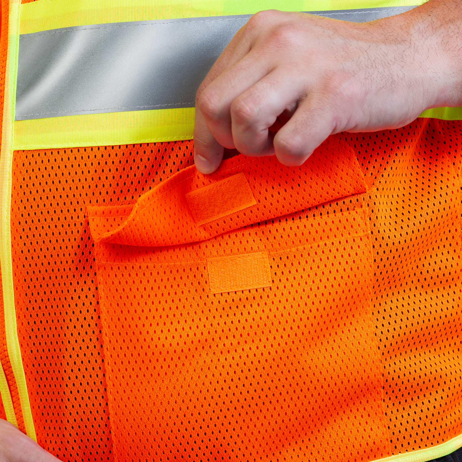 Close up of the pocket on the reflective safety vest with zipper closure