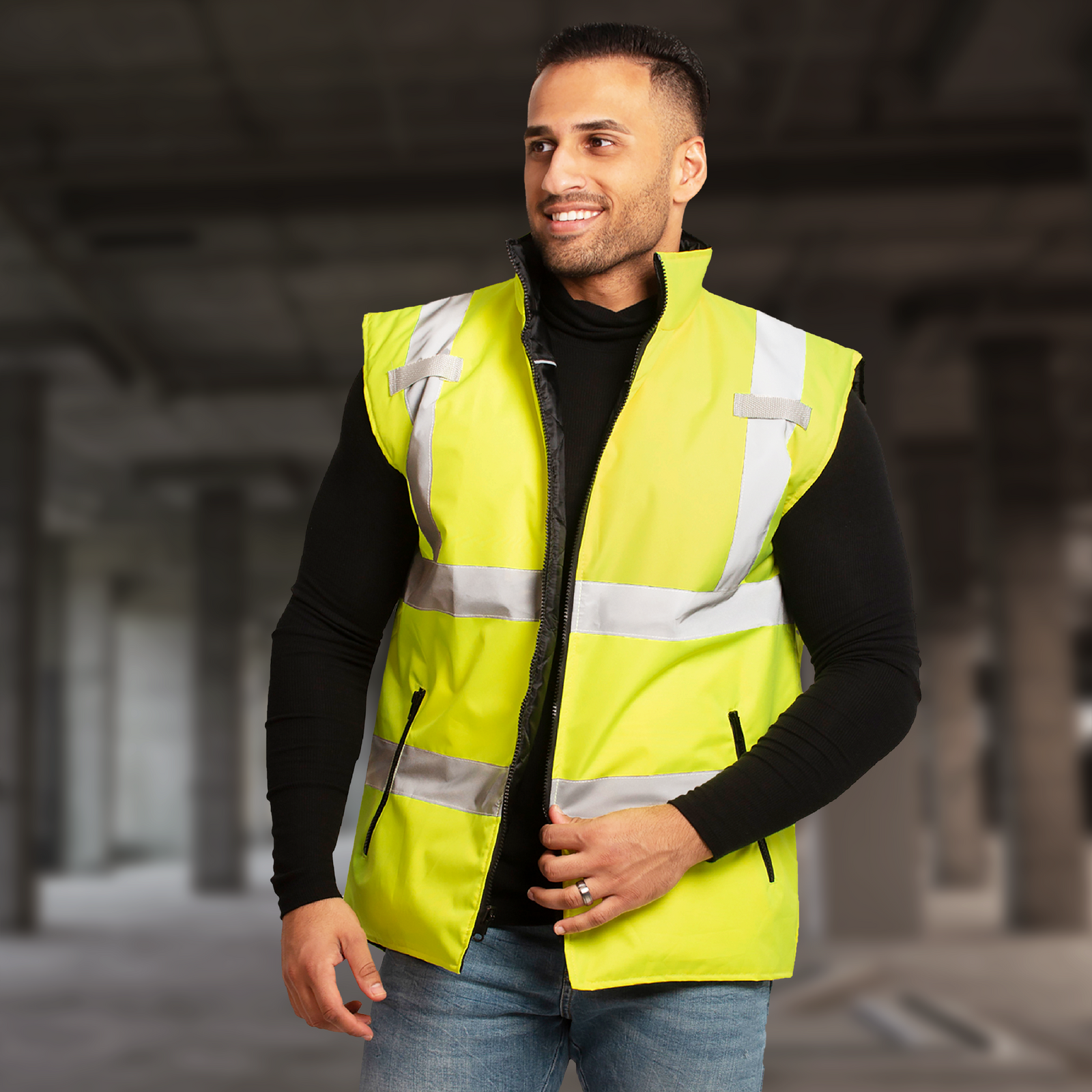 A man wearing the yellow side out of the reversible safety ANSI class 2 type R