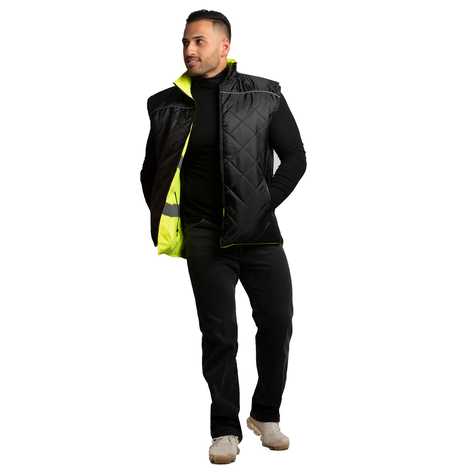 A man wearing the high visibility JORESTECH reversible safe vest  with the back side out.