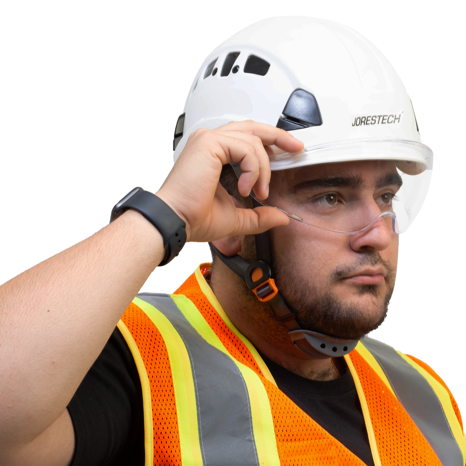 Worker wearing a white hard hat with the JORESTECH eye shield installed. The man is grabbing the eye shield for hard hats to place away from his face.
