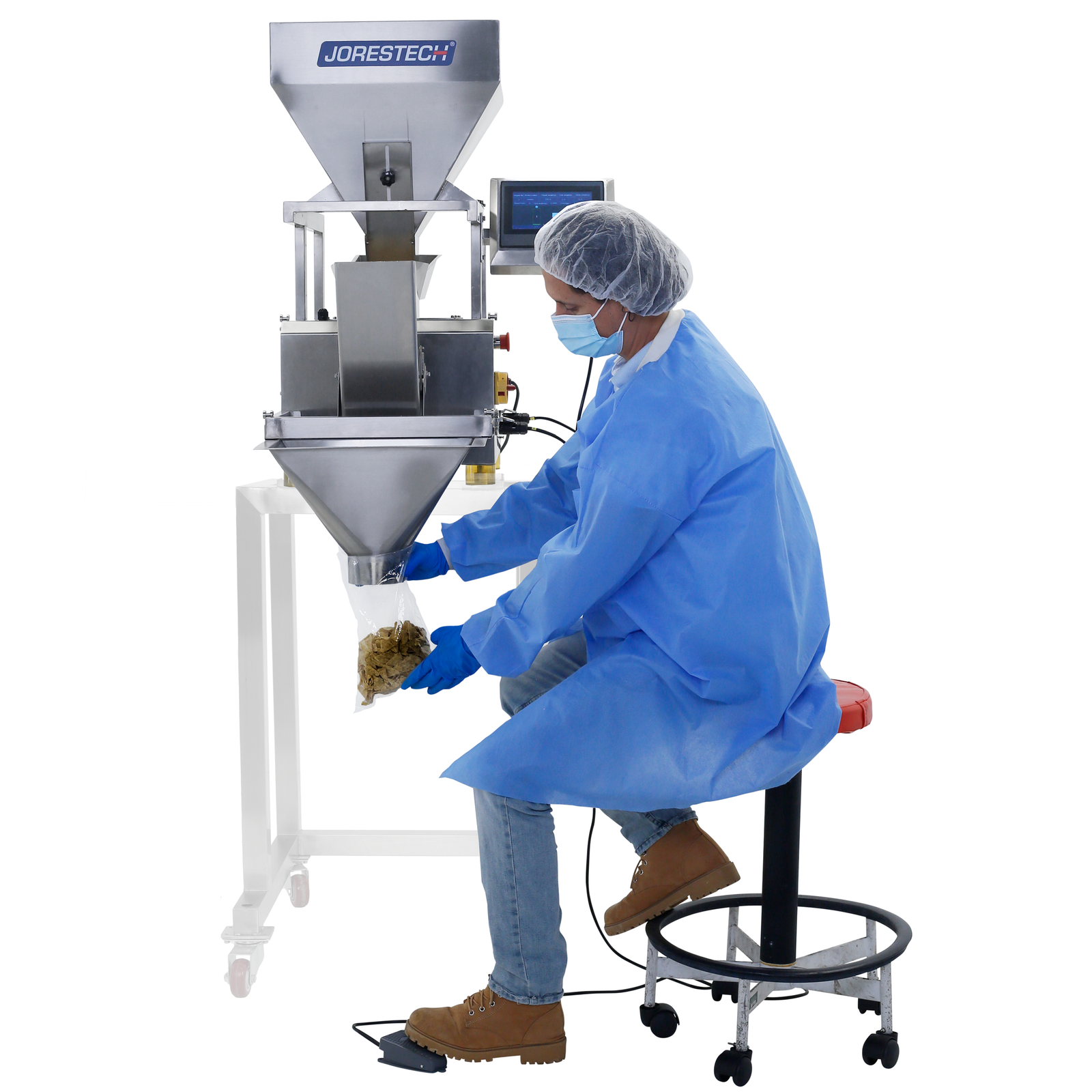 operator using the foot pedal to command the JORES TECHNOLOGIES® linear weighing machine to dispense product into a bag. The machine can be seen placed on top of a stand, specifically built for this machine, which can be optionally purchased.