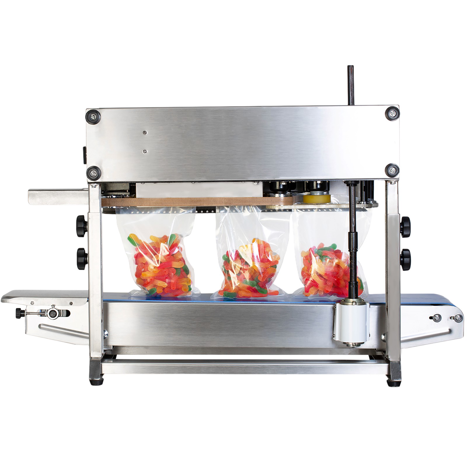 back view of stainless steel band sealing JORES TECHNOLOGIES® machine sealing clear bags filled with vibrant multi-colored gummy worms.