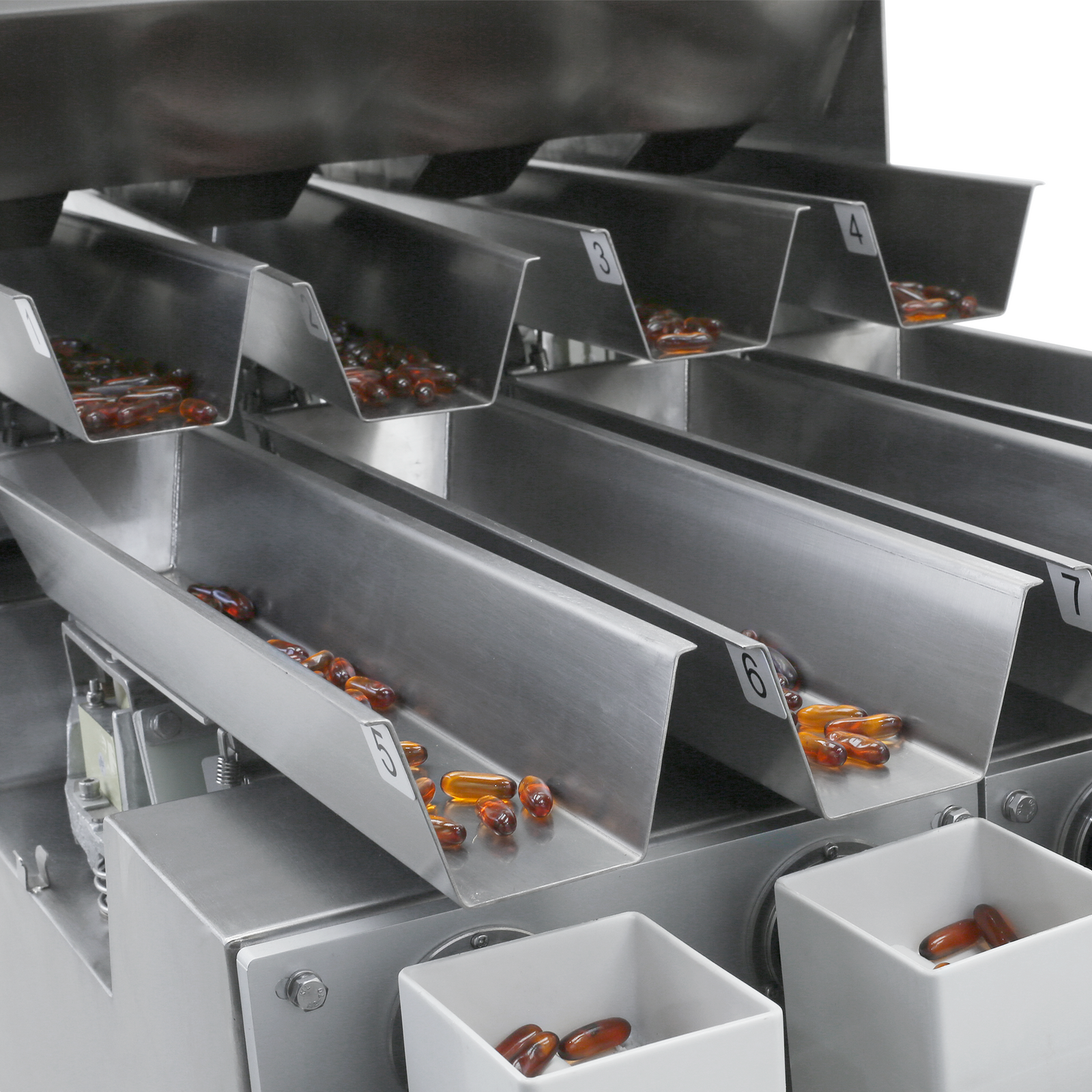 Close-up of a JORES TECHNOLOGIES® four head linear weigher measuring and dispensing gel pills