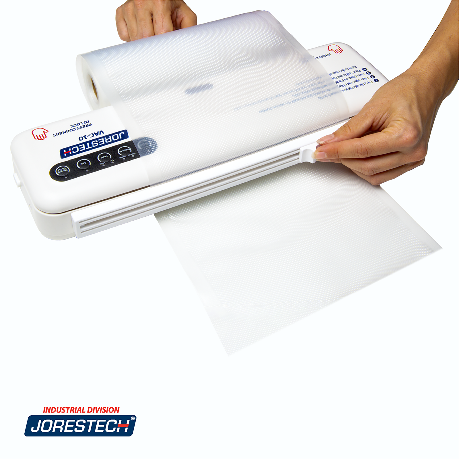 A person's hands can be seen using the bag cutter on the back of a JORES TECHNOLOGIES®  tabletop vacuum sealer for home use in order to make their own custom-sized bags. 
