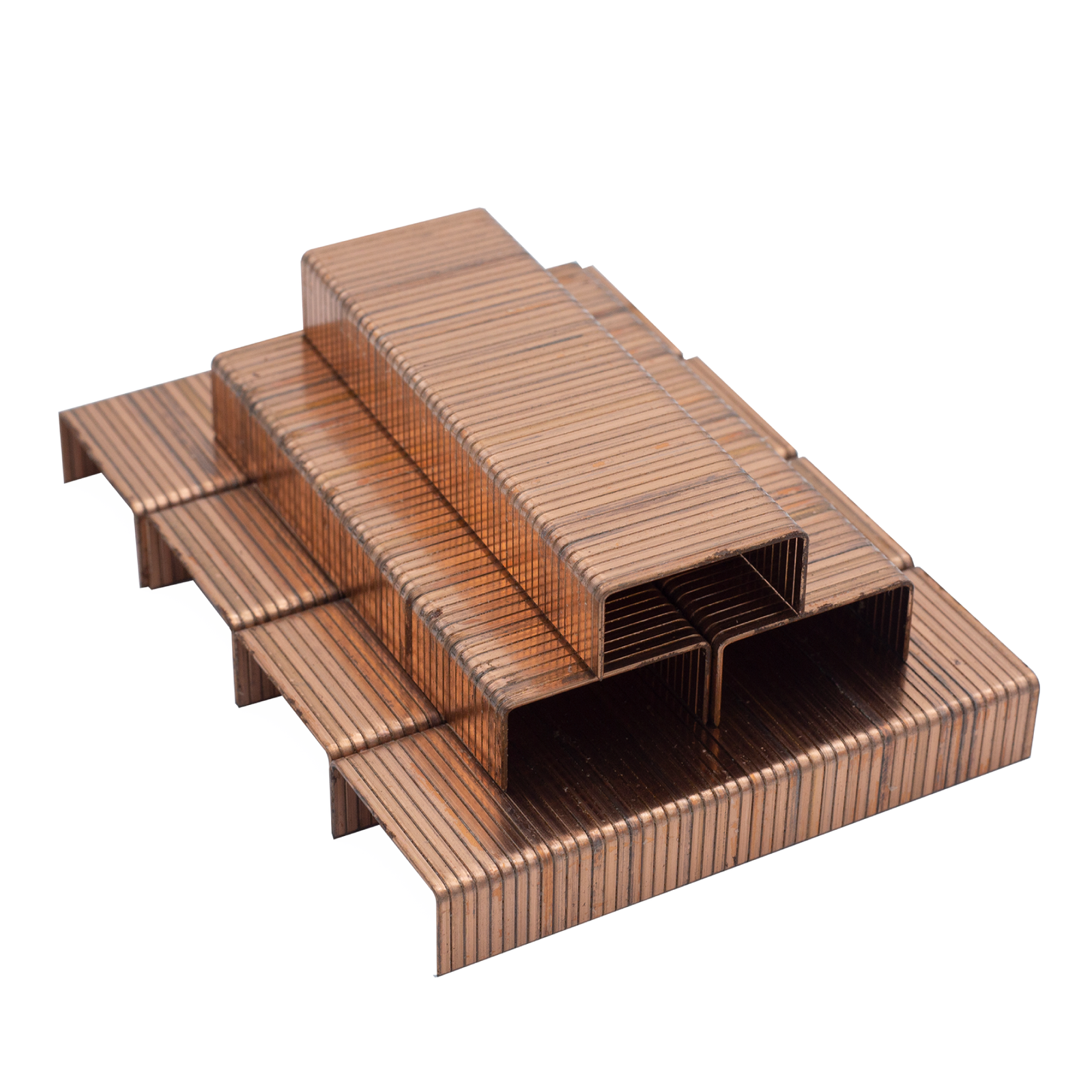 various sticks of copper-colored industrial staples stacked up