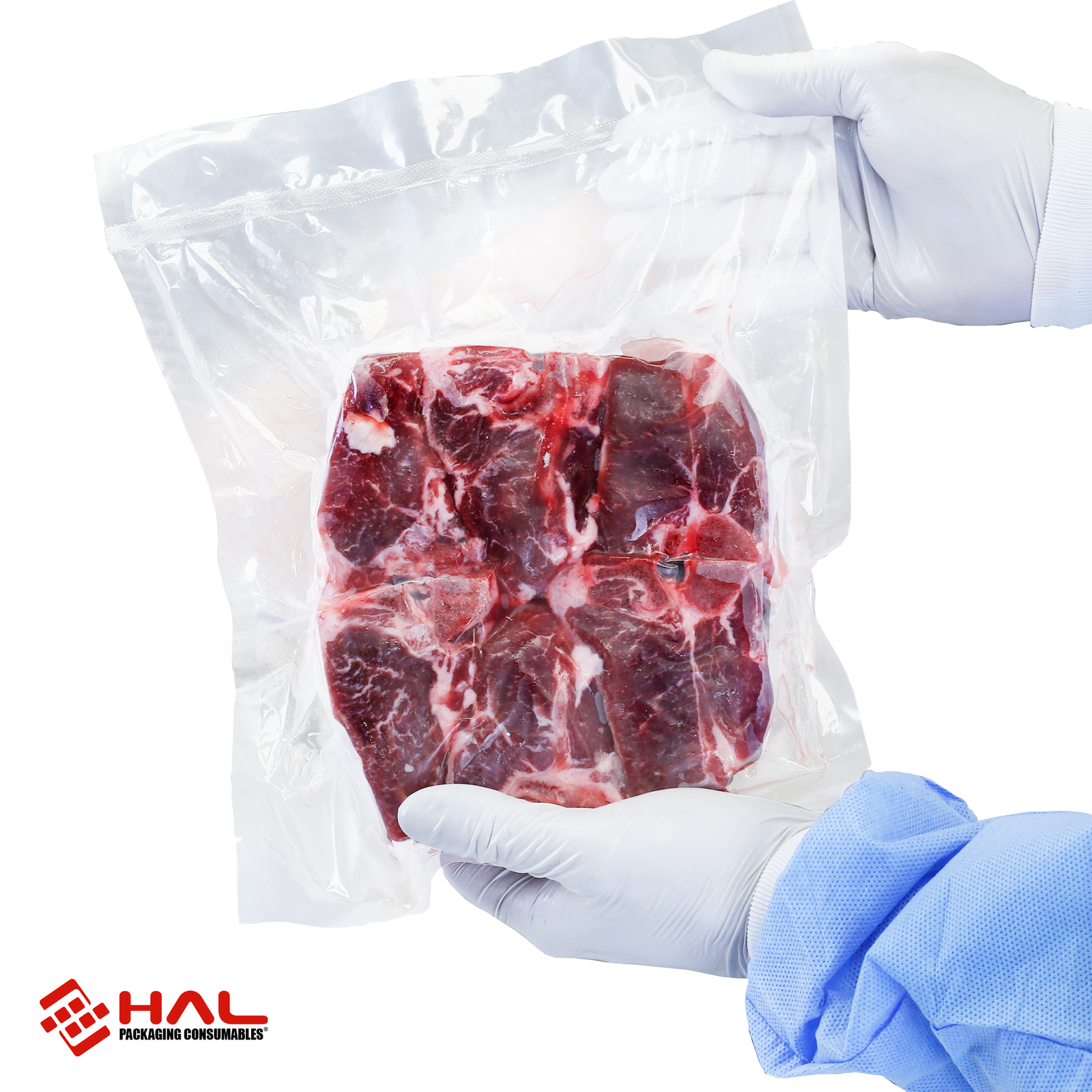 Hands of a person holding a vacuumed sealed bag with a large piece of raw meet inside. Vacuum pouch was sealed and vacuumed with the JORES TECHNOLOGIES® commercial dual reclinable chamber vacuum sealer