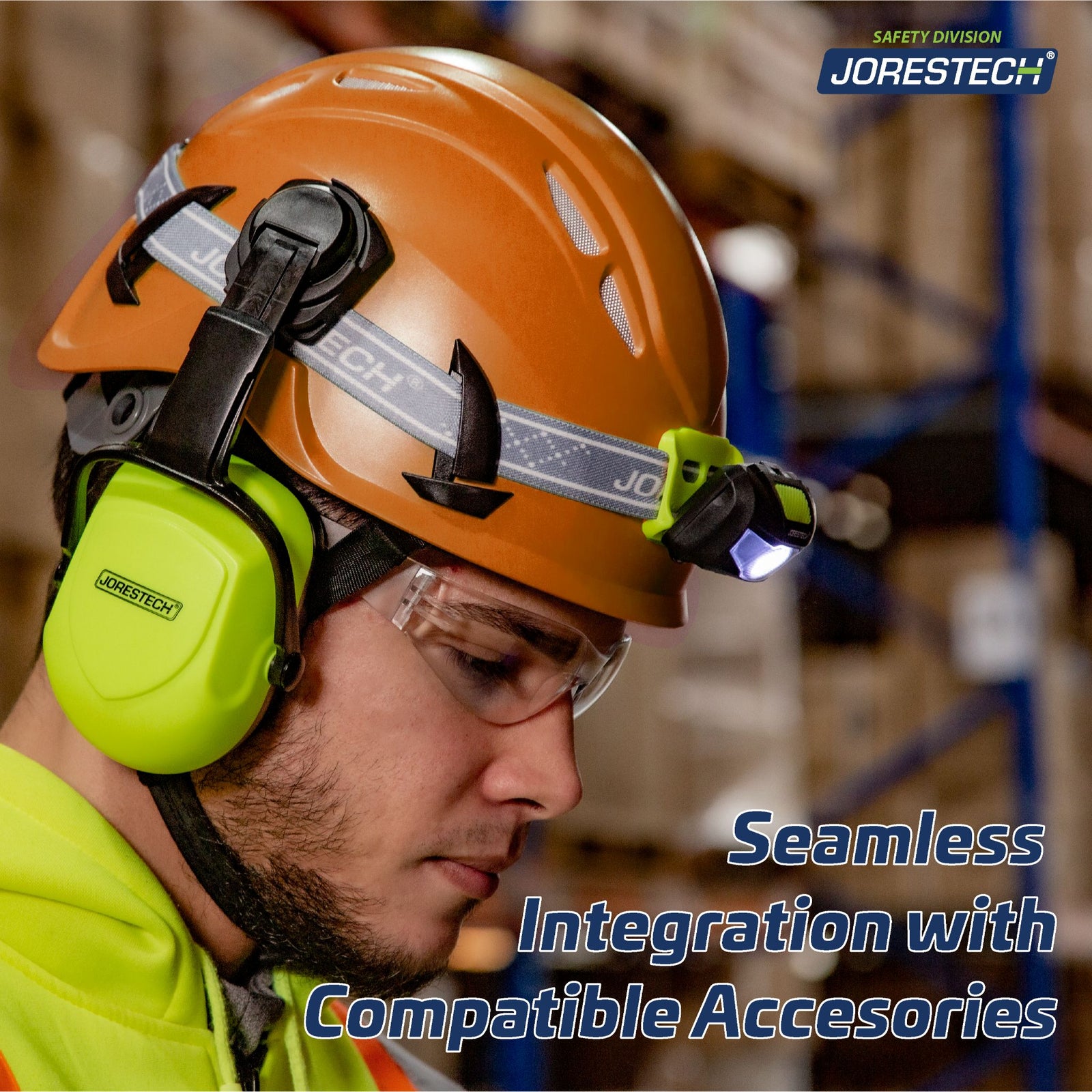 a WORKER in a warehouse setting wearing the orange ventilated climbing hard hat with a blue text that reads: Seamless Integration with compatible accessories. The hard hat has a black headlamp attached as well as a pair of lime earmuffs