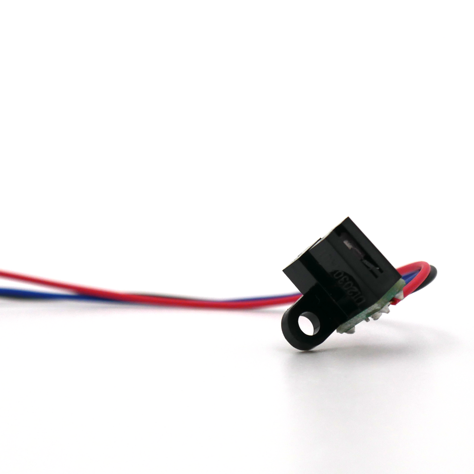 Close up of the black JORES TECHNOLOGIES coding position sensor with red, black and blue cables.