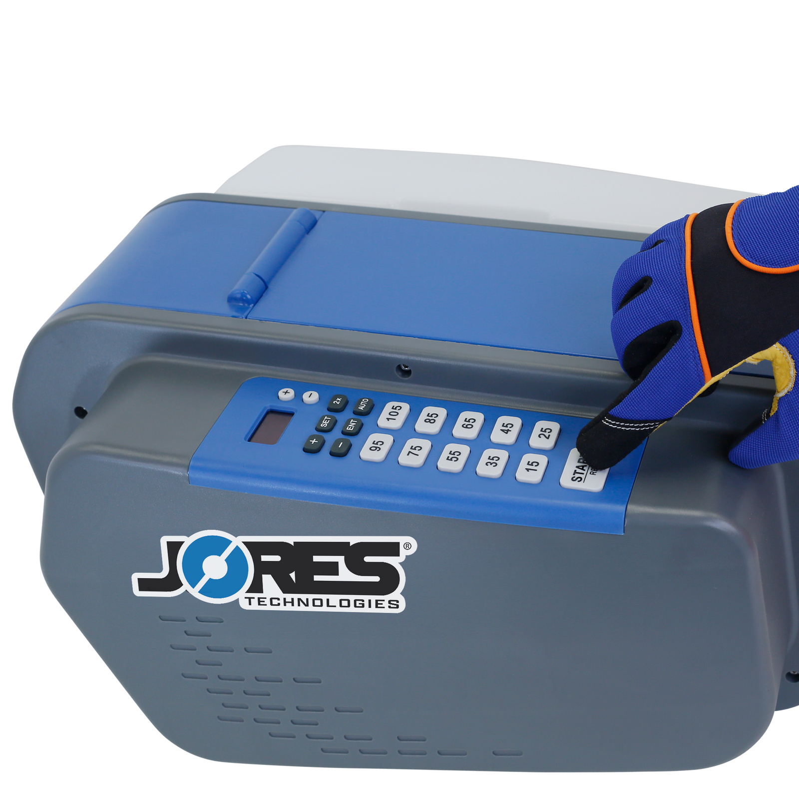 The hand of a worker wearing a safety glove while pressing the start bottom of the JORES TECHNOLOGIES® tape dispenser
