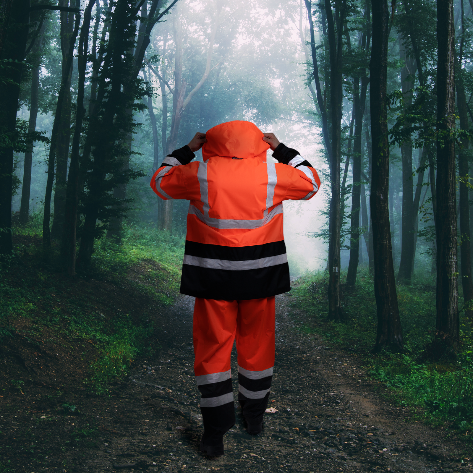 Worker using the Hi Vis Orange Safety Rain Set pant and jacket