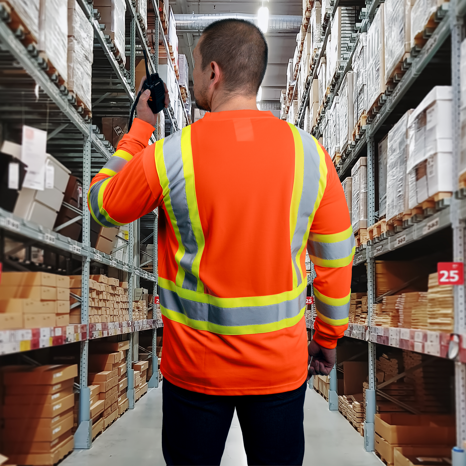 Man wearing the Orange Hi visibility safety long sleeve shirt for work inside a warehouse