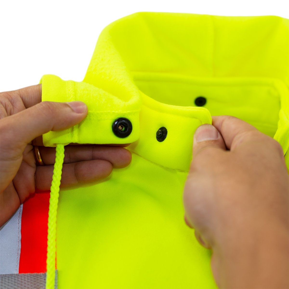 Jorestech high-visibility lime-yellow safety hoodie detachment detail, demonstrating the button closure mechanism for removing or securing the hood onto the mock-neck collar.
