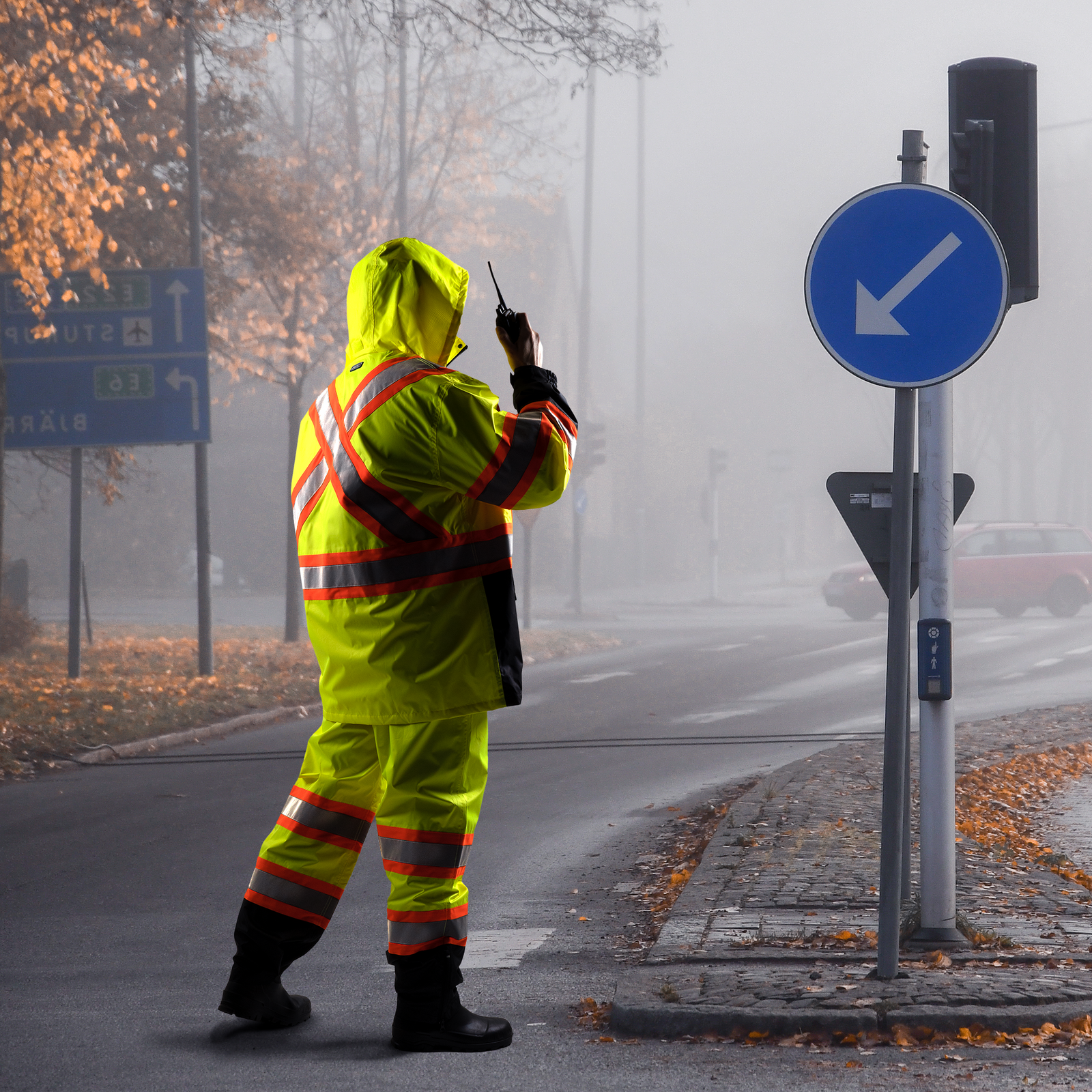 Worker wearing the JORESTECH ANSI complaint rain set for weather protection.