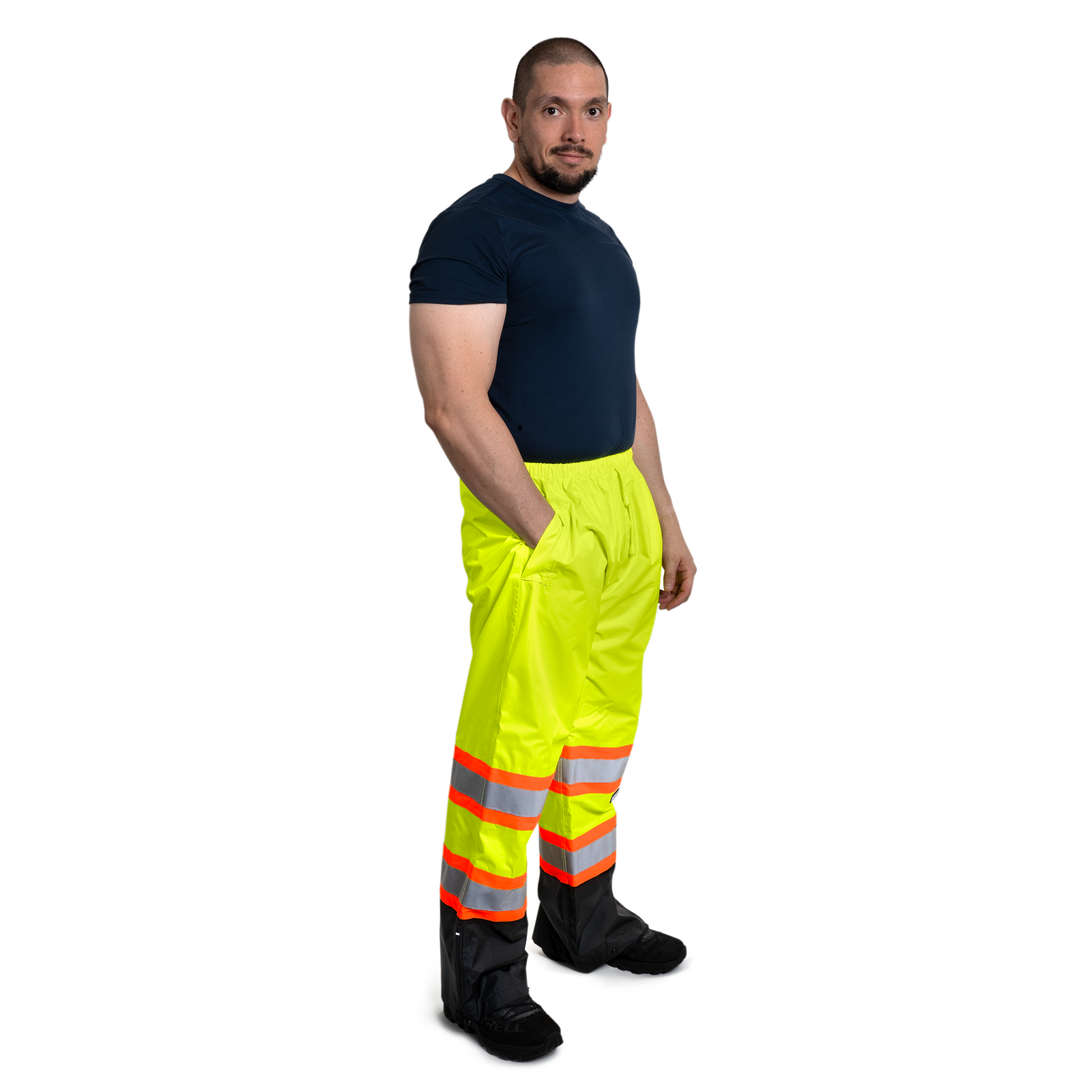 Man wearing the hi vis two tone safety rain pants with reflective and contracting stripes for road protection