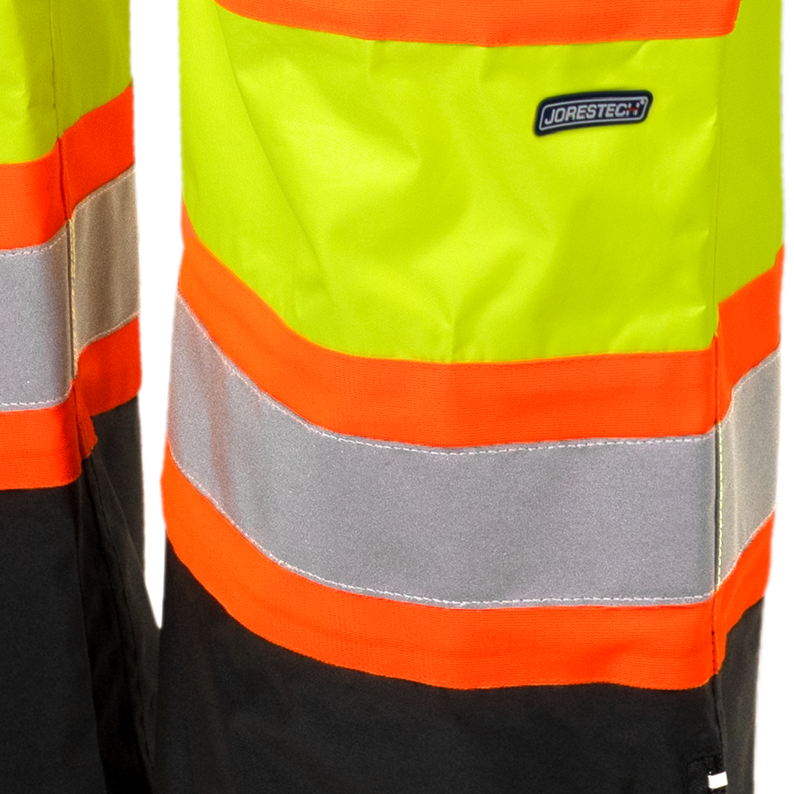 Closeup of the yellow safety rain pants with reflective stripes, contrasting orange lines and dirt concealing black fabric