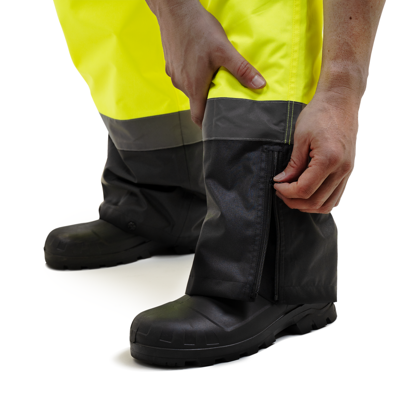 Close up of the boot zippered opening on the hi vis safety overall pants with reflective stripes