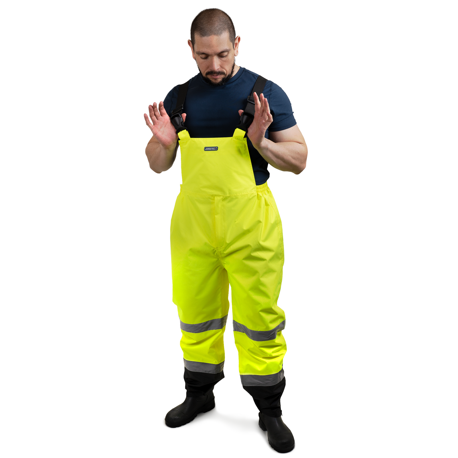 Worker wearing the hi visibility yellow and black safety overall work pants with reflective stripes