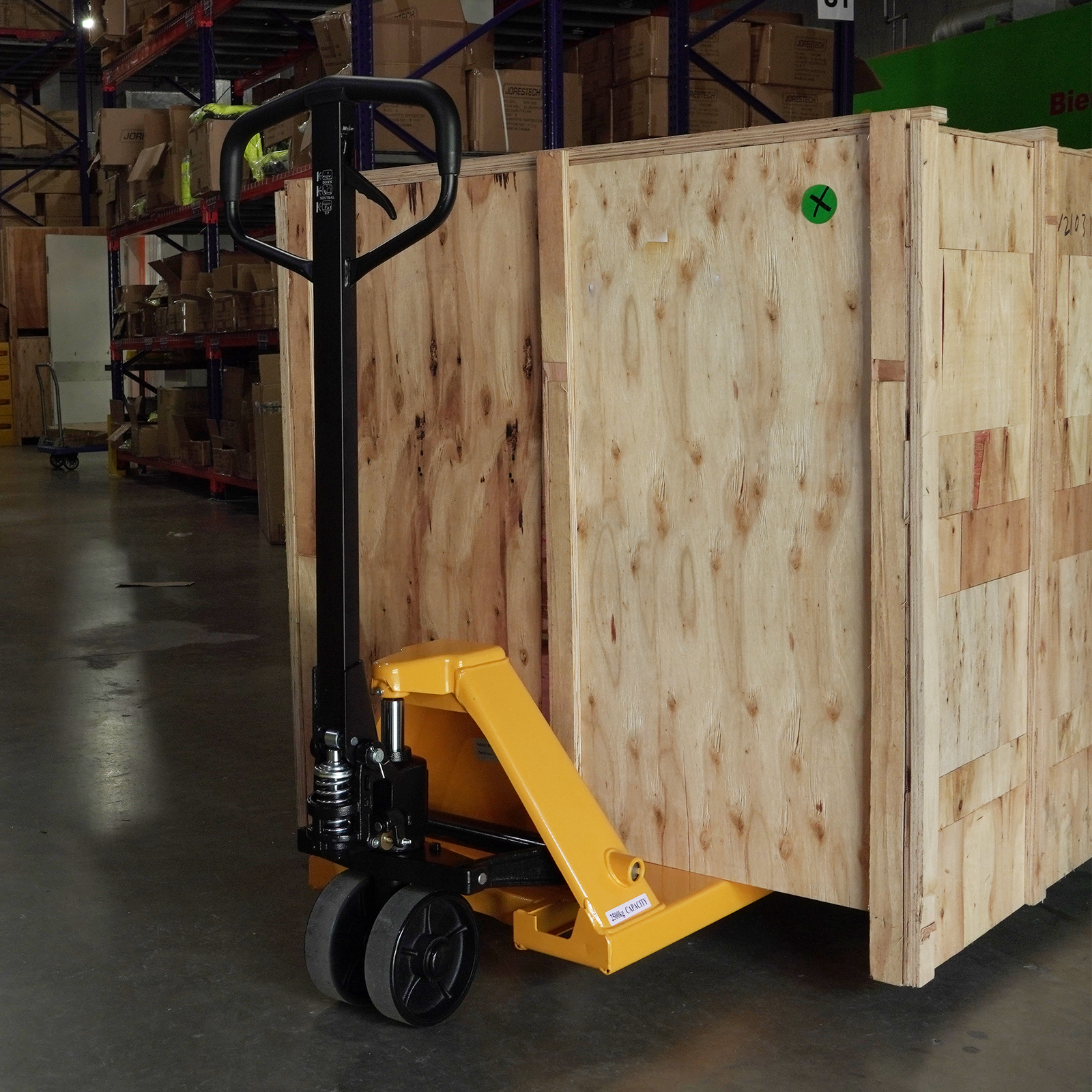 Narrow pallet jack truck with a wooden cate on top