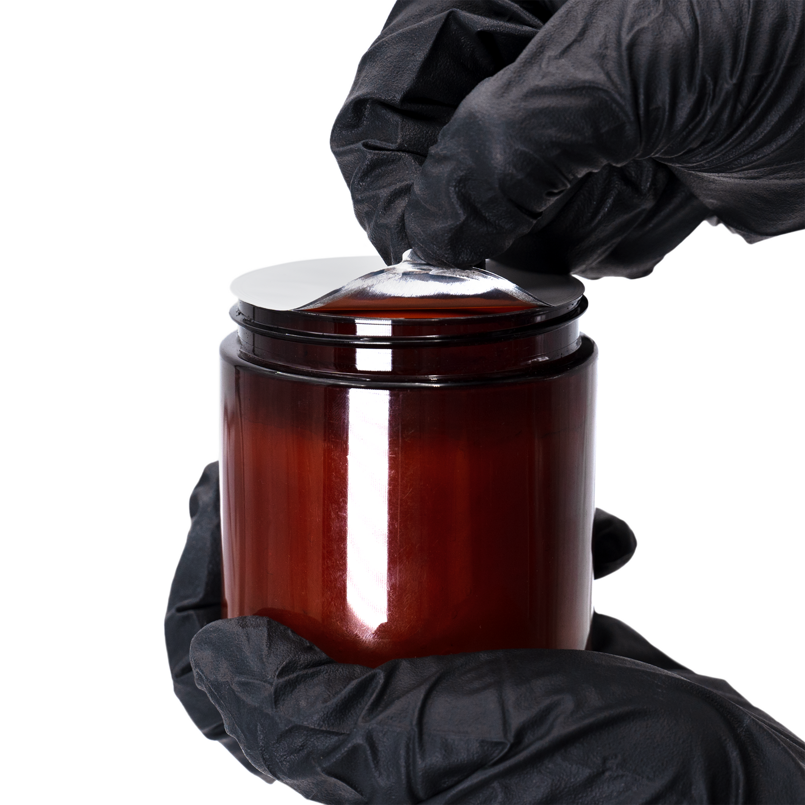 The hand of a person removing and induction sealer from a container
