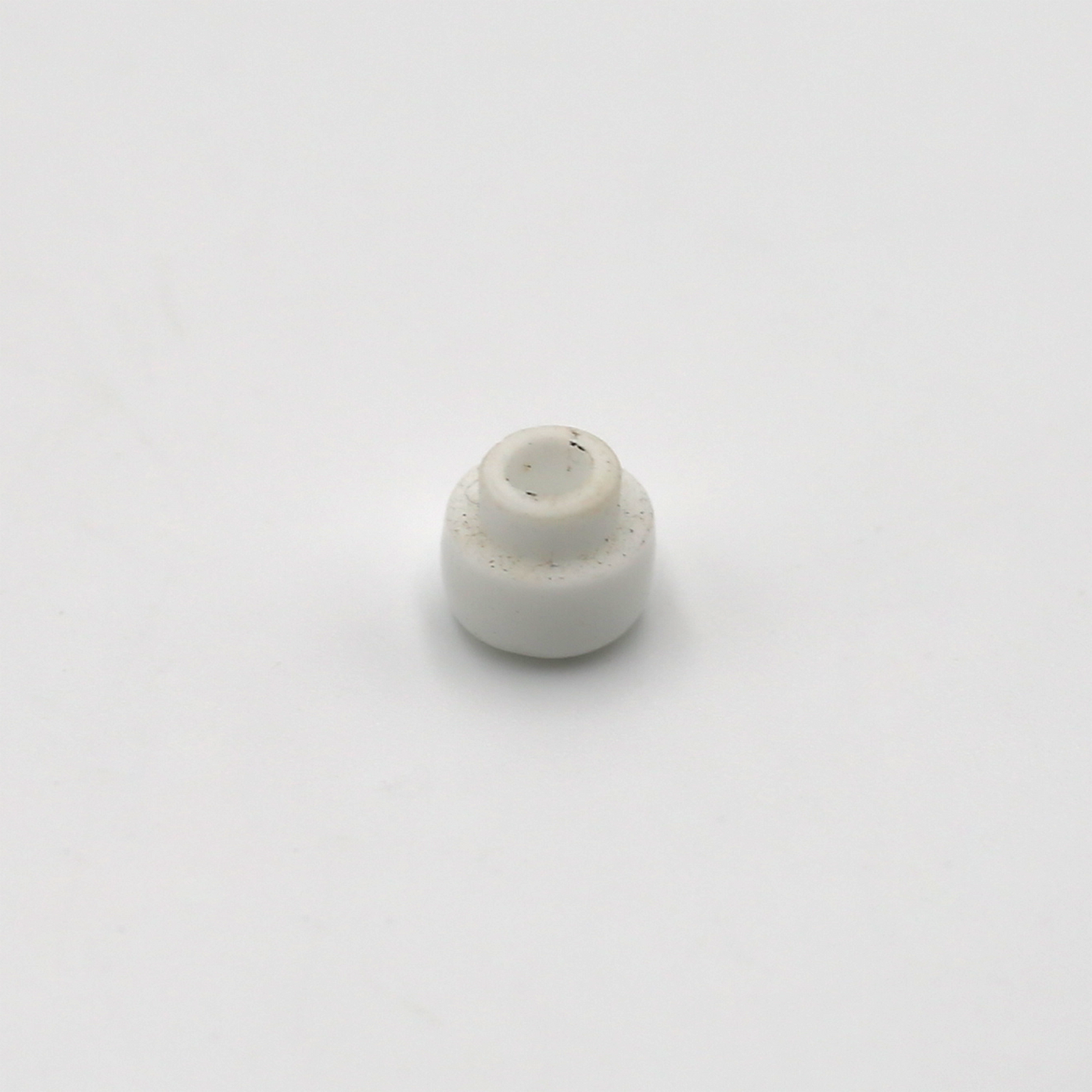 Porcelain tip replacement part for low density piston fillers