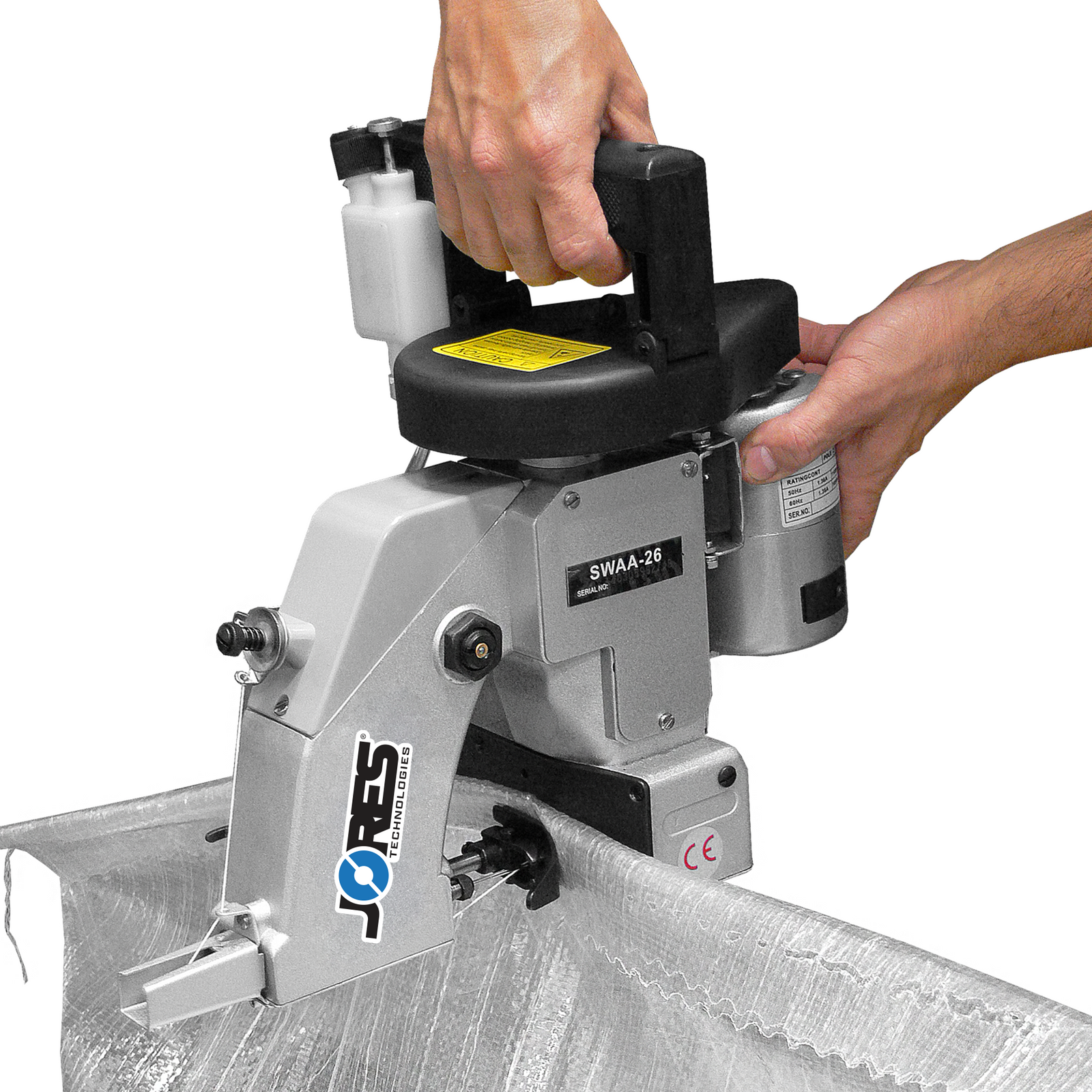 operator using the portable steel electric bag sewing machine to stitch closed a white bag