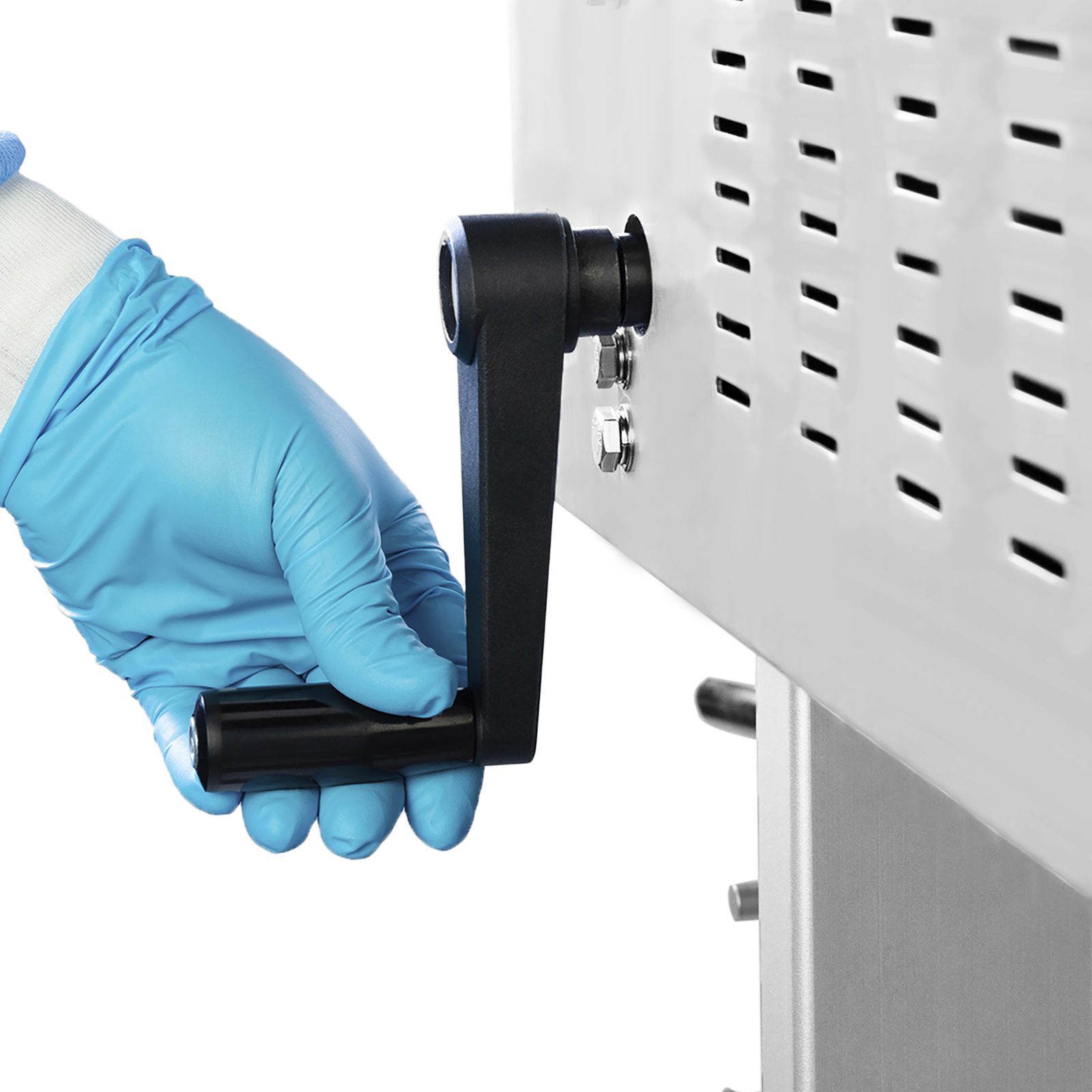 Operator wearing blue gloves adjusting the height of the sealing machine with the black removable handle before starting production
