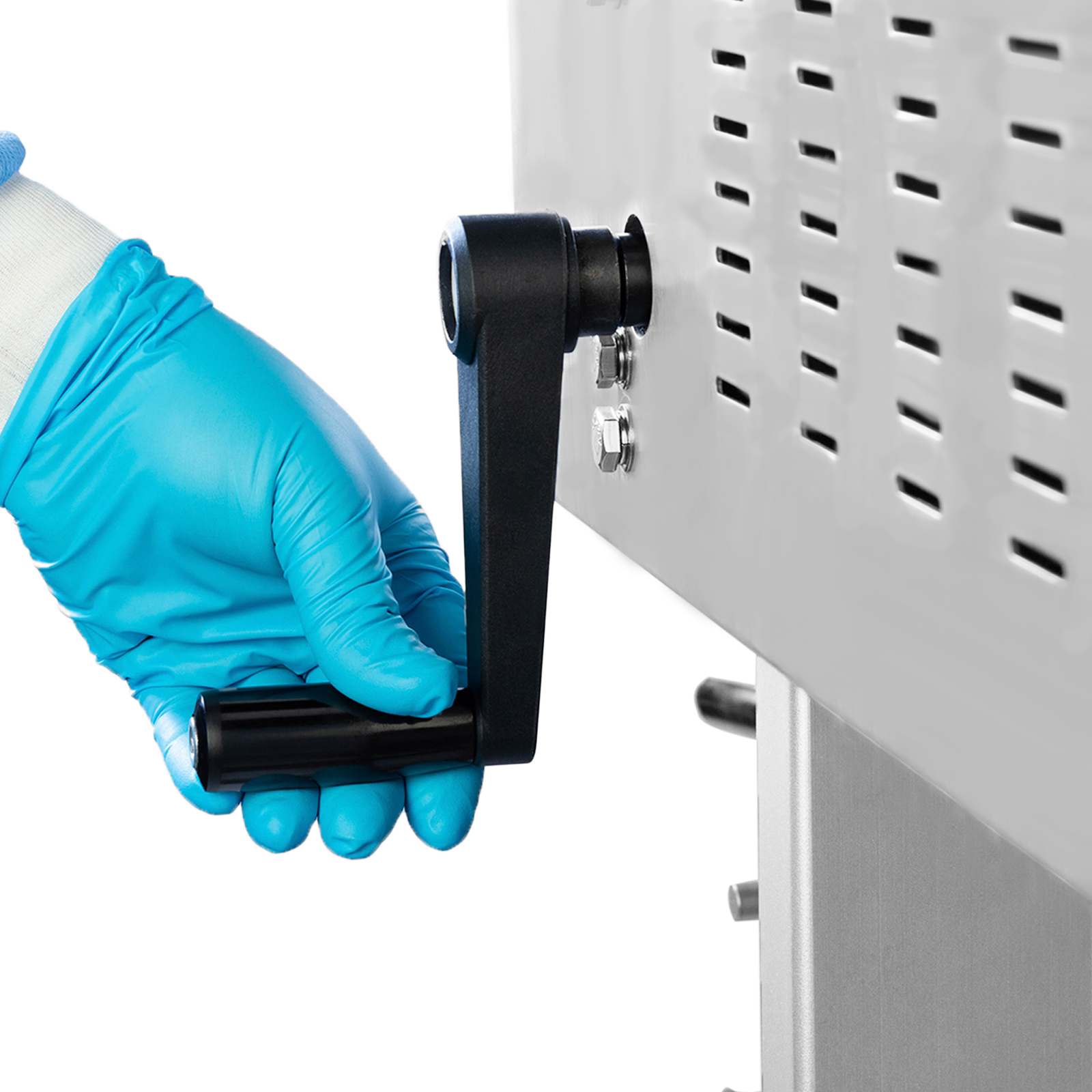 Operator wearing blue gloves adjusting the height of the sealing machine with the black removable handle before starting production