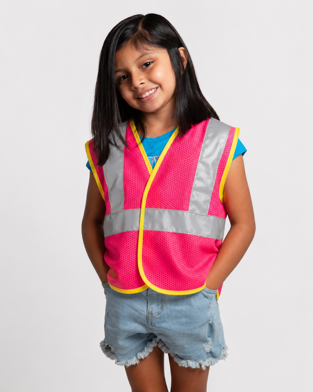 Girl wearing the JORESTECH pink Children's hi-vis mesh safety vest with 2 inches reflective strips