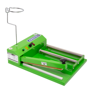 Green JORESTECH shrink sealing system with a shrink roll holder, impulse sealer, and heat gun receptacle over a white background.