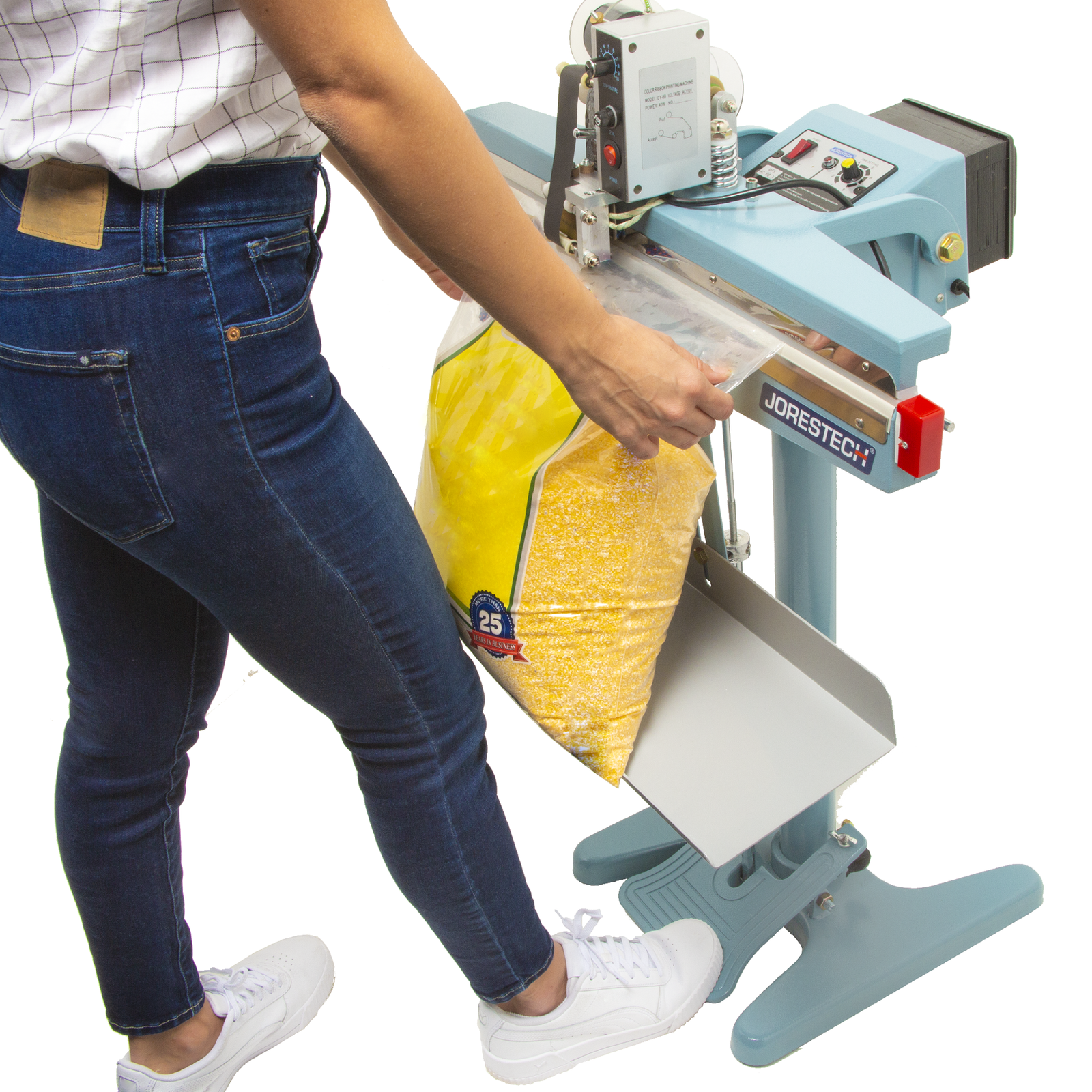 A worker sealing extra large plastic bag filled with corn using the 18 inch foot impulse bag sealer with coder