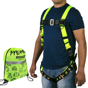 The torso of a person wearing the hi-vis yellow and black 1D fall protection safety body JORESTECH harness with grommets. Also shows the hi-vis string bag that comes included with the harness