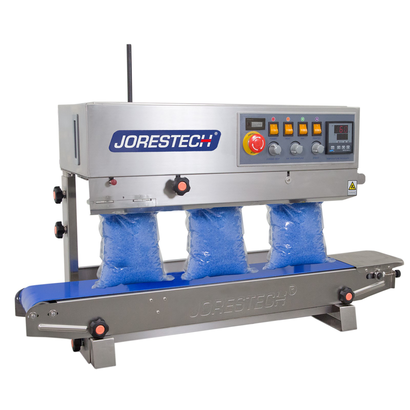 stainless steel JORESTECH continuous band sealer sealing several plastic bags filled with blue wax beads