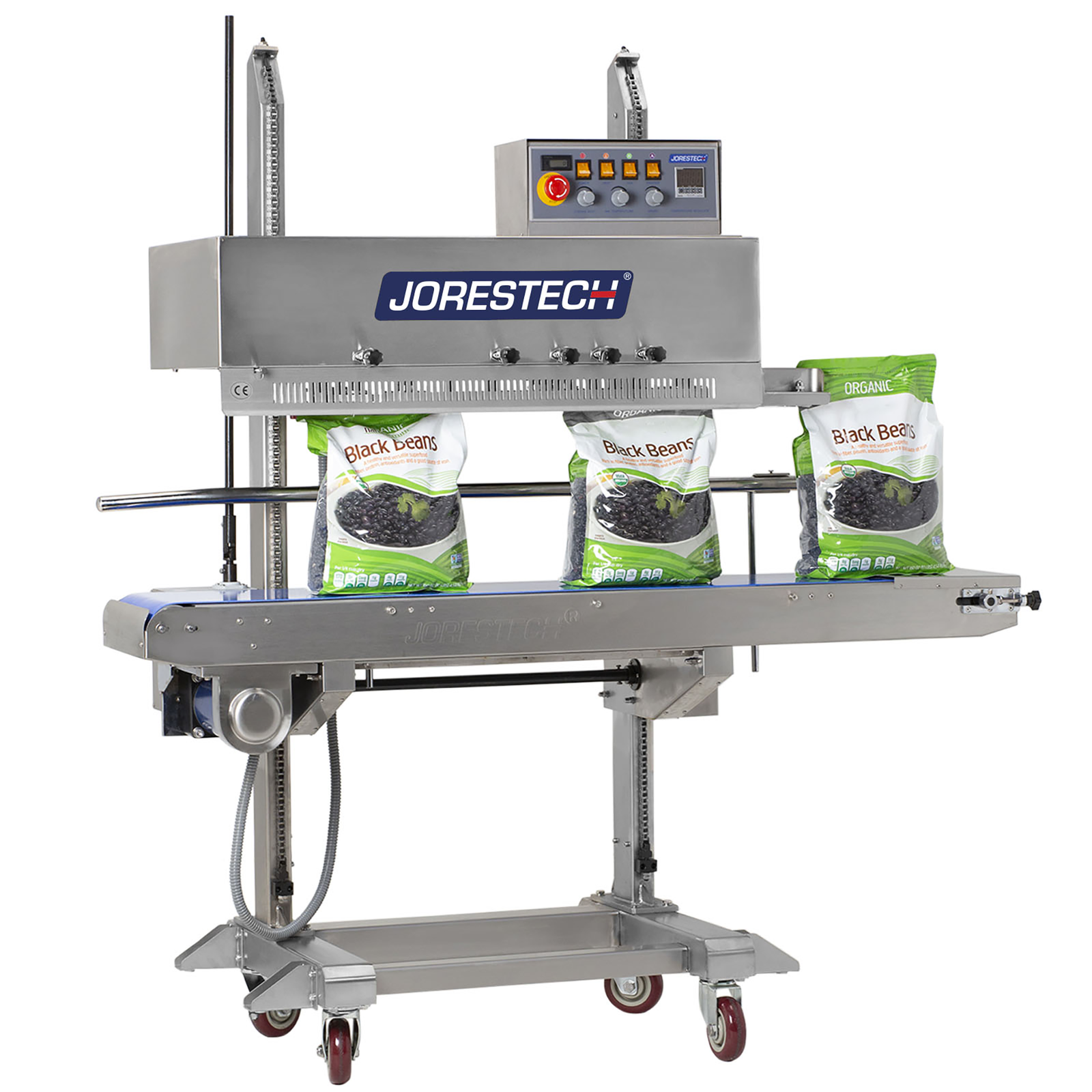 Front view of the stainless steel JORESTECH vertical continuous band sealer with coder and blue JORESTECH logo and emergency red stop button sealing a production of large plastic bags filled with black beans