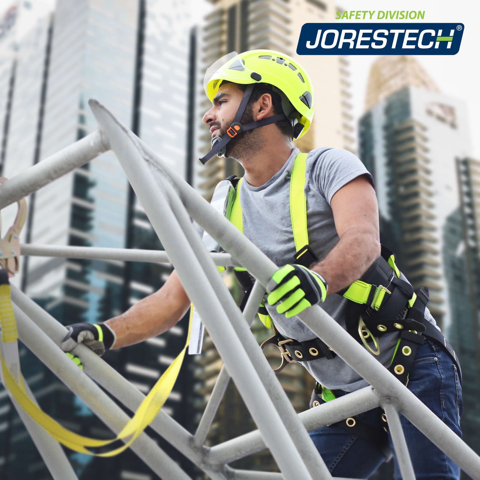 A man wearing the Jorestech 3D Fall protection safety tower body harness with grommets and back support. The man is climbing a metal tower to which he is attached to by a yellow lanyard.