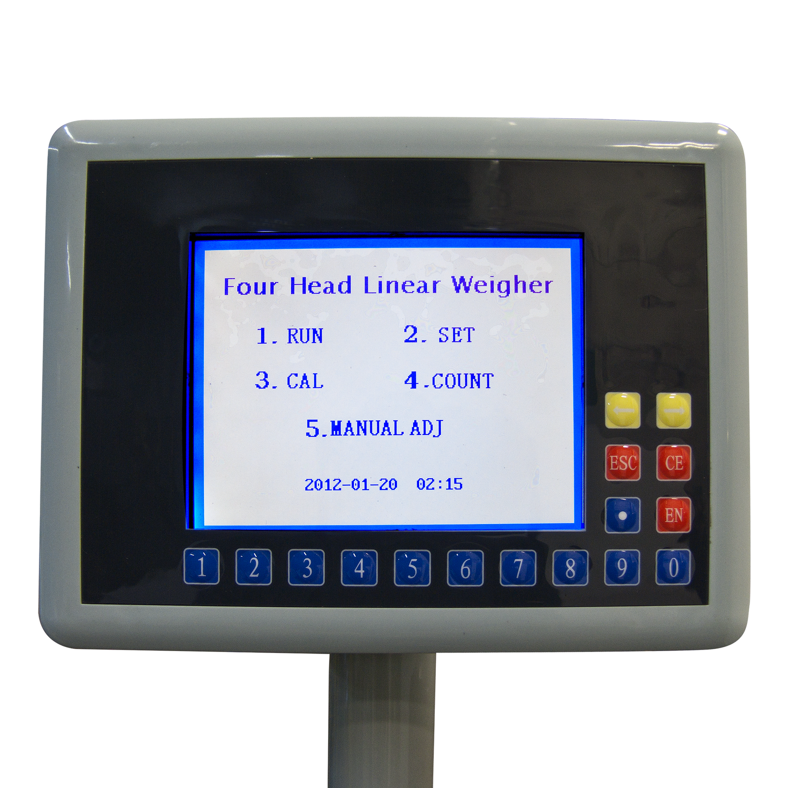 Control panel with LCD display on a JORESTECH® 4 head linear weigh machine. The screen is on and shows the options of Run, Set, Calibrate, Count, and Manual adjustment