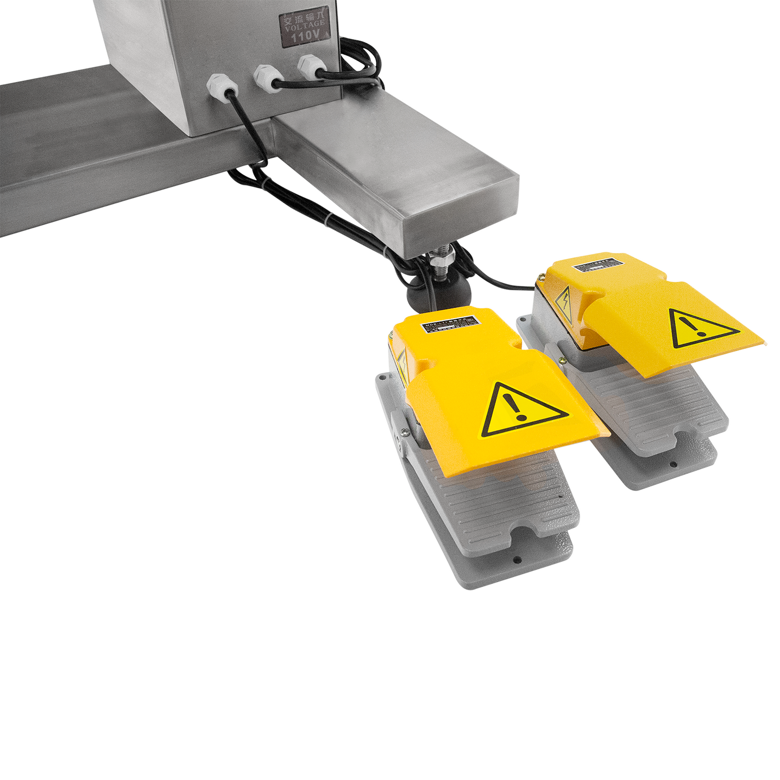Two foot pedals with yellow safety foot coverings belonging to the automatic Jorestech dual head high viscosity filling system