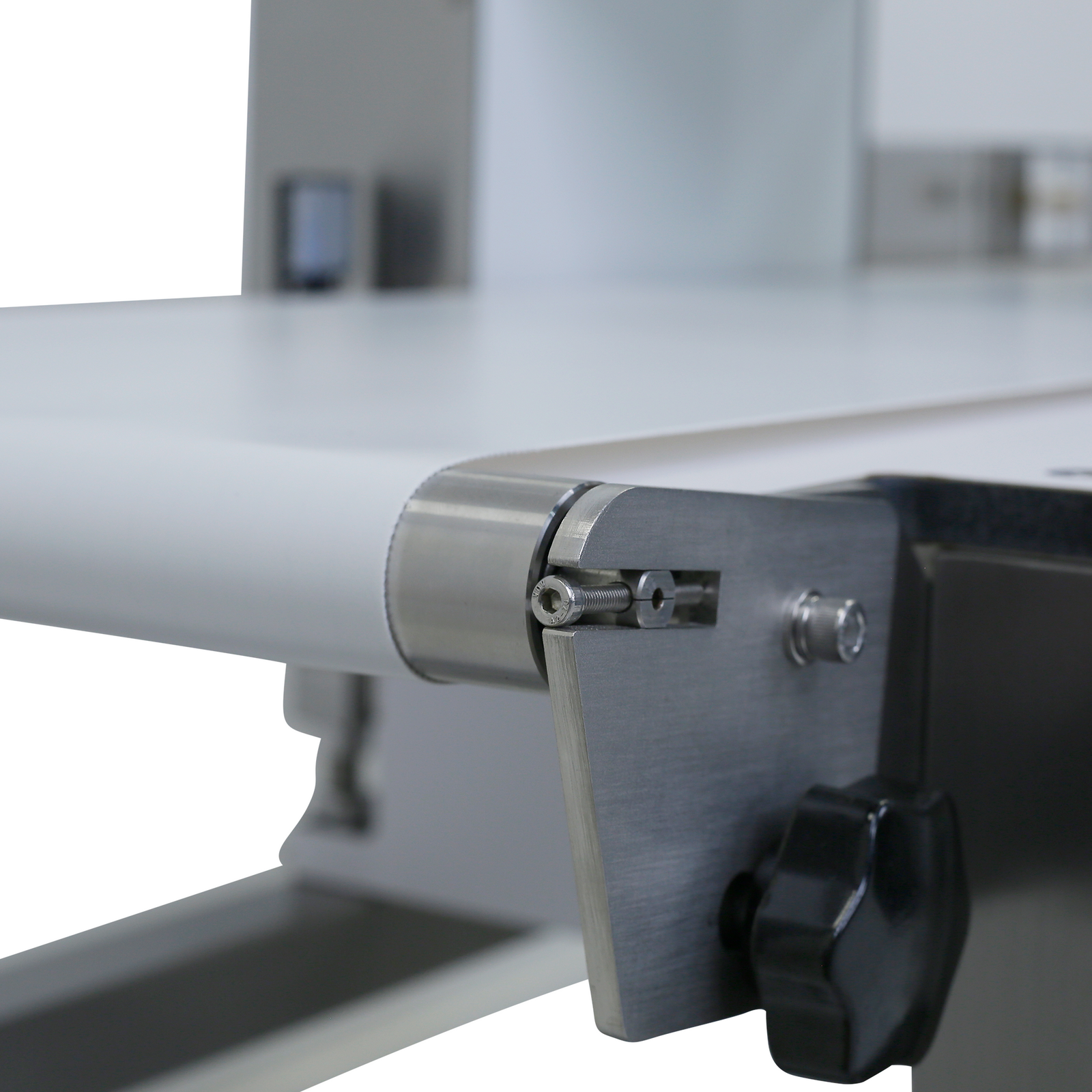 close-up of white motorized conveyor in the automatic food detector with reject system