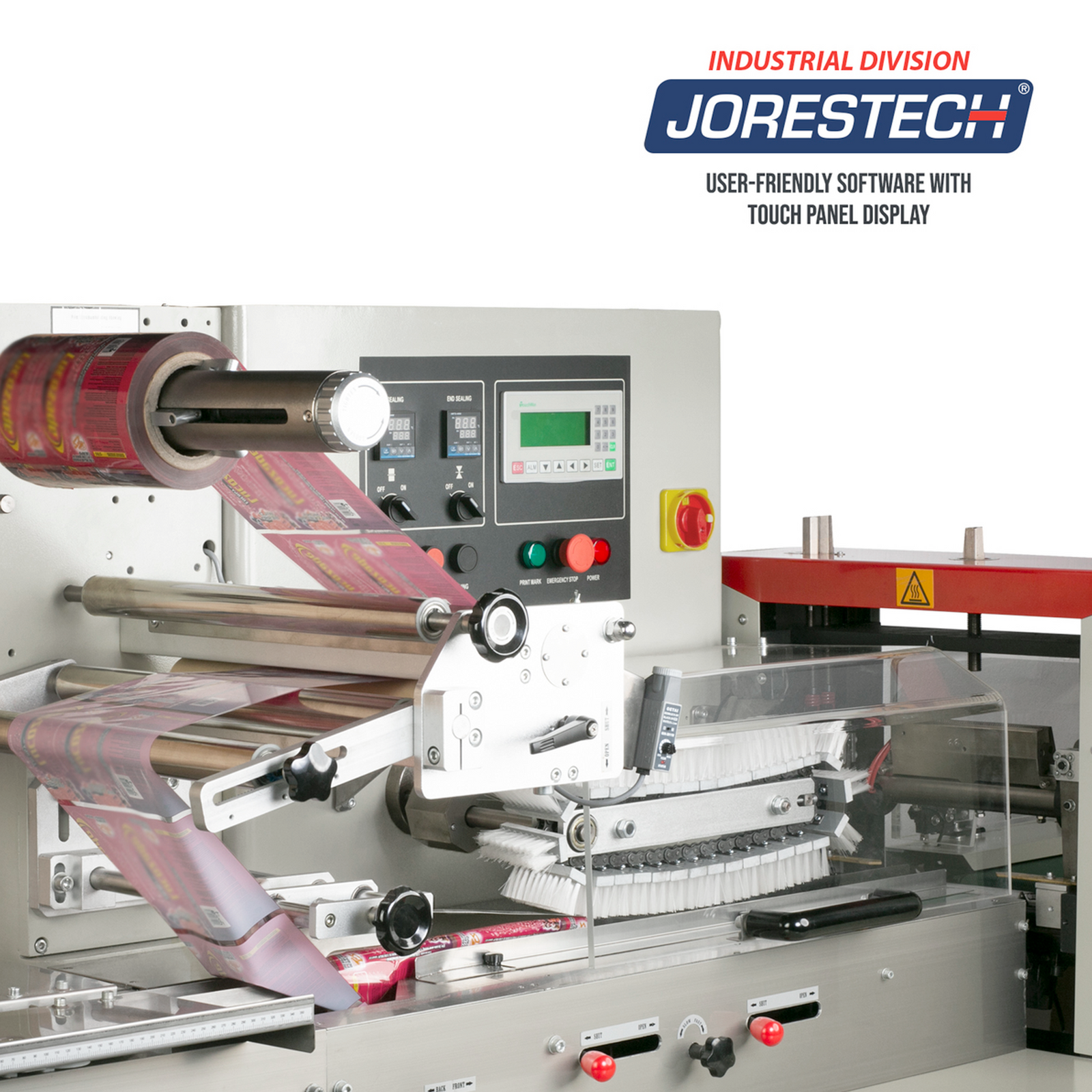 The packaging and sealing area on an automatic HFFS flow pack system. The film roll holder is equipped with a red packaging film roll threaded through the machine and ready for use.  Jorestech industrial logo is shown and a statement that reads User friendly software with touch panel display