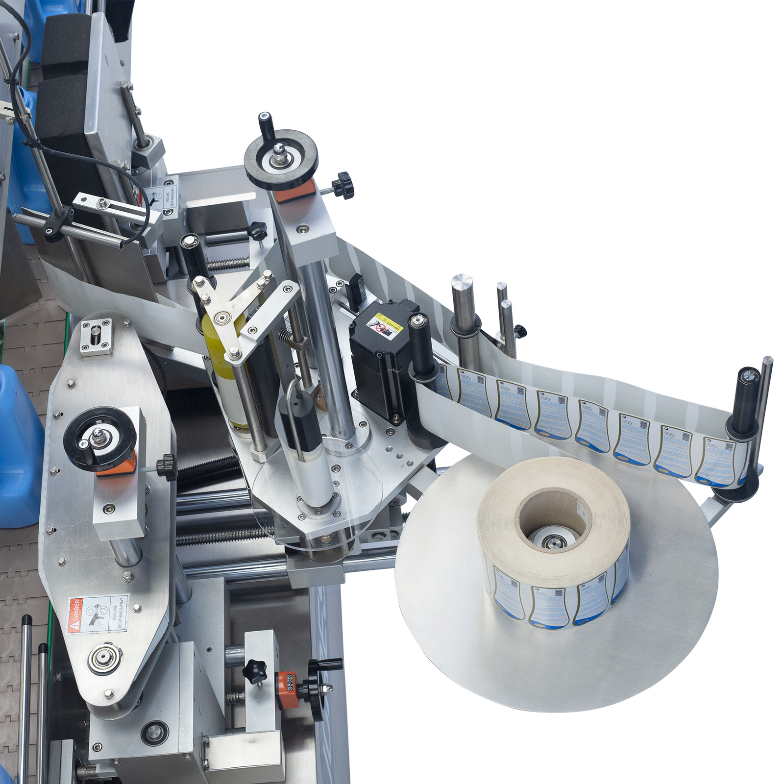Detail of a large roll of stickers places on the JORES TECHNOLOGIES® label applicator component on the stainless steel dual automatic label applicator 