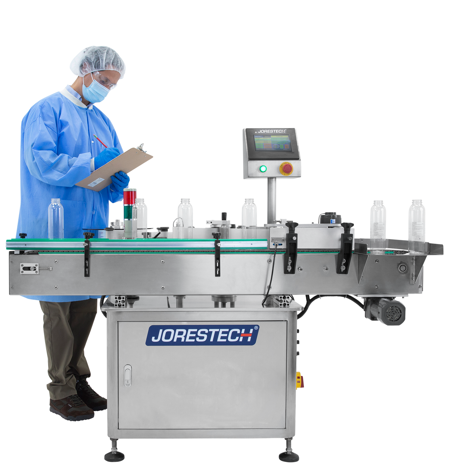 man wearing hairnet, mask, and blue protective gown checking brown clipboard and looking at clear containers on stainless steel JORESTECH automatic label applicator for small and medium round bottles 