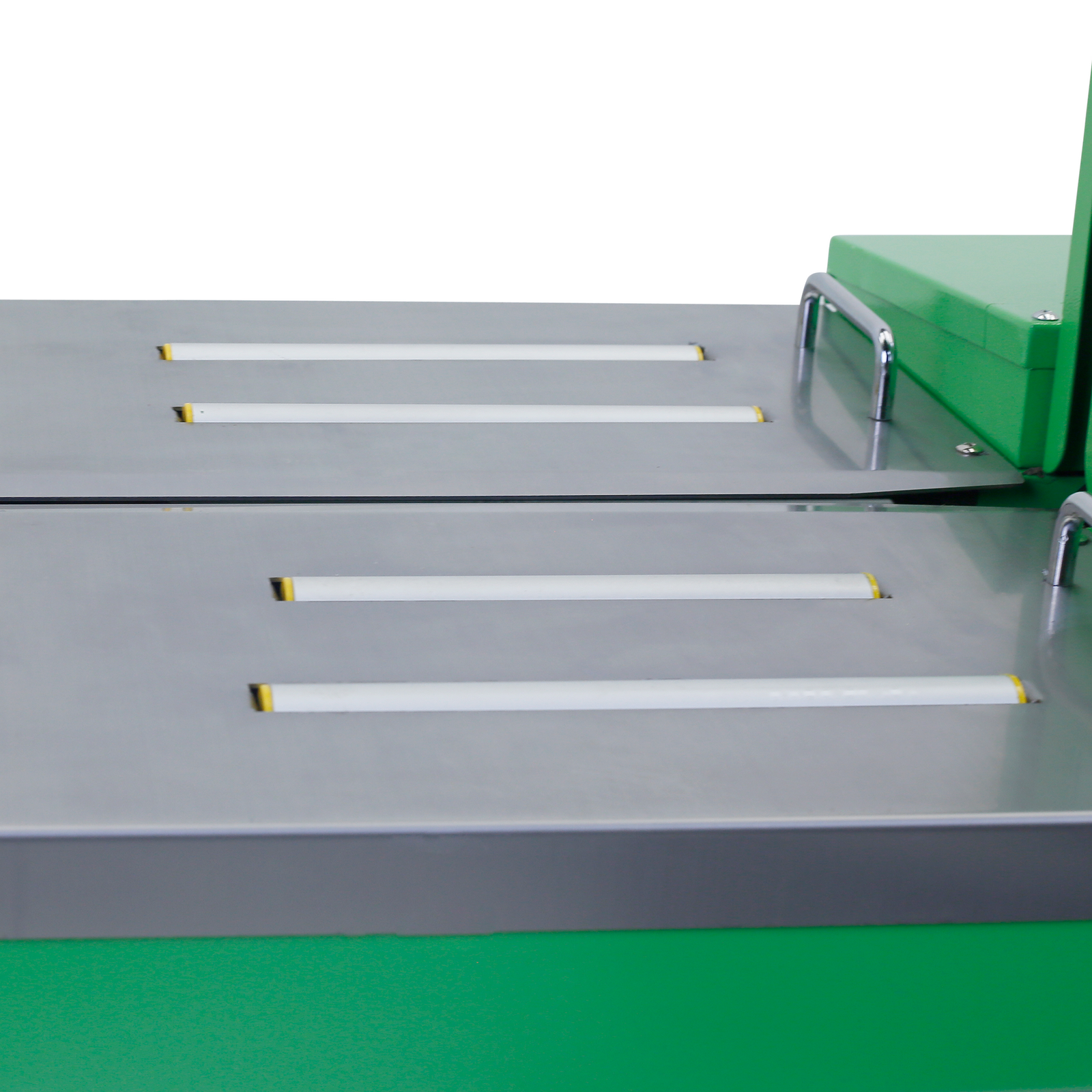 Close up of the stainless steel tray and rolls where items that need to be strapped are positioned